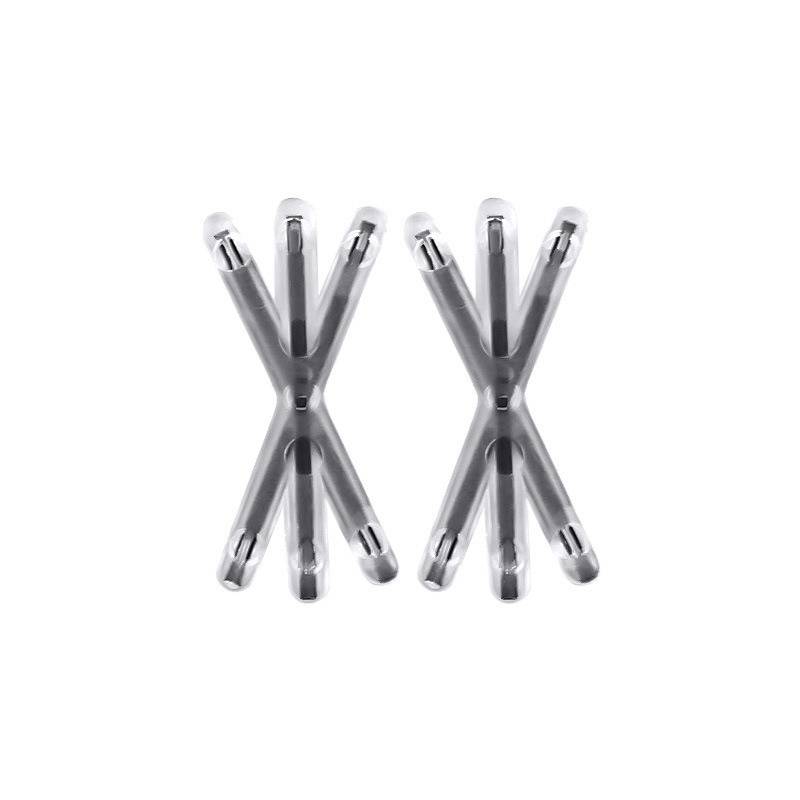 Zwei metallische X-förmige Multitool- oder stiftähnliche Objekte mit weißen Kappen, nebeneinander auf einem einfachen weißen Hintergrund dargestellt.