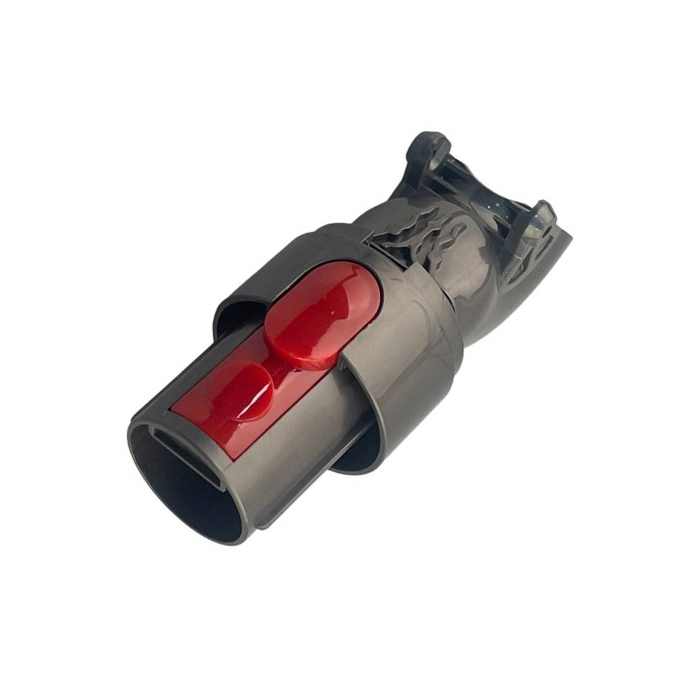 Nahaufnahme eines grauen und roten Kunststoffsteckers oder Adapters auf weißem Hintergrund.