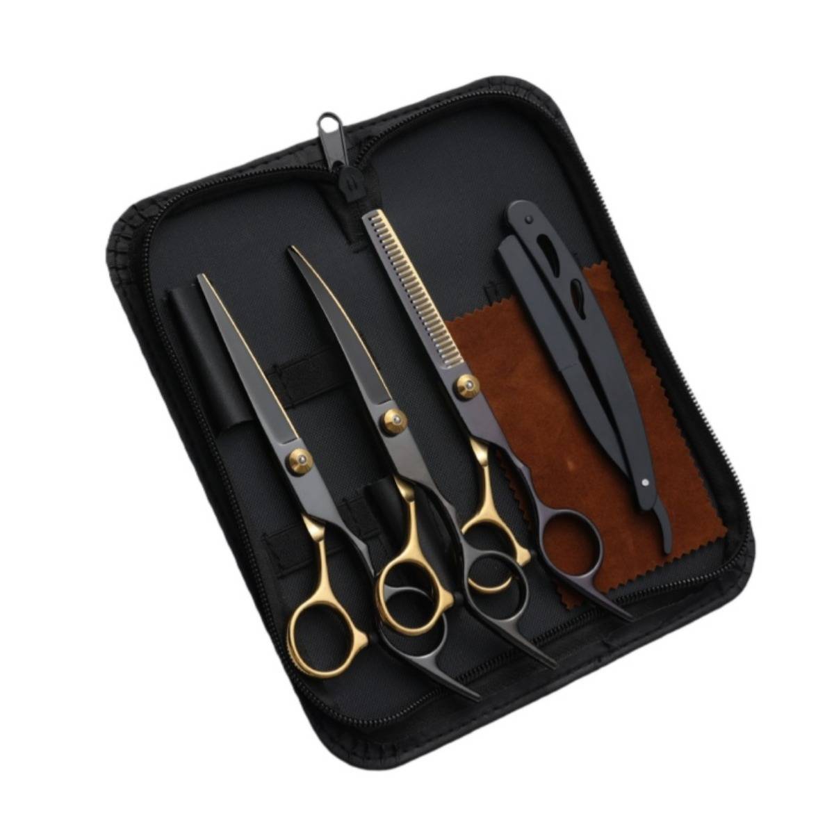 Offene Schachtel mit drei Haarscheren mit goldenem Griff, einer Kammschere und einem Rasiermesser auf einer braunen Stoffeinlage.