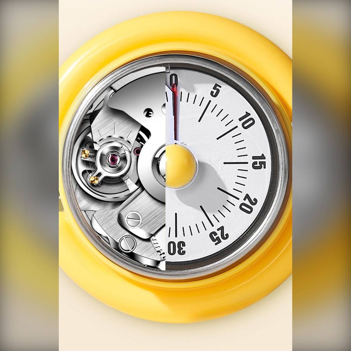 Gelber runder Timer, in der Mitte geteilt, zeigt auf der linken Seite seinen inneren Mechanismus und auf der rechten Seite ein nummeriertes Zifferblatt.