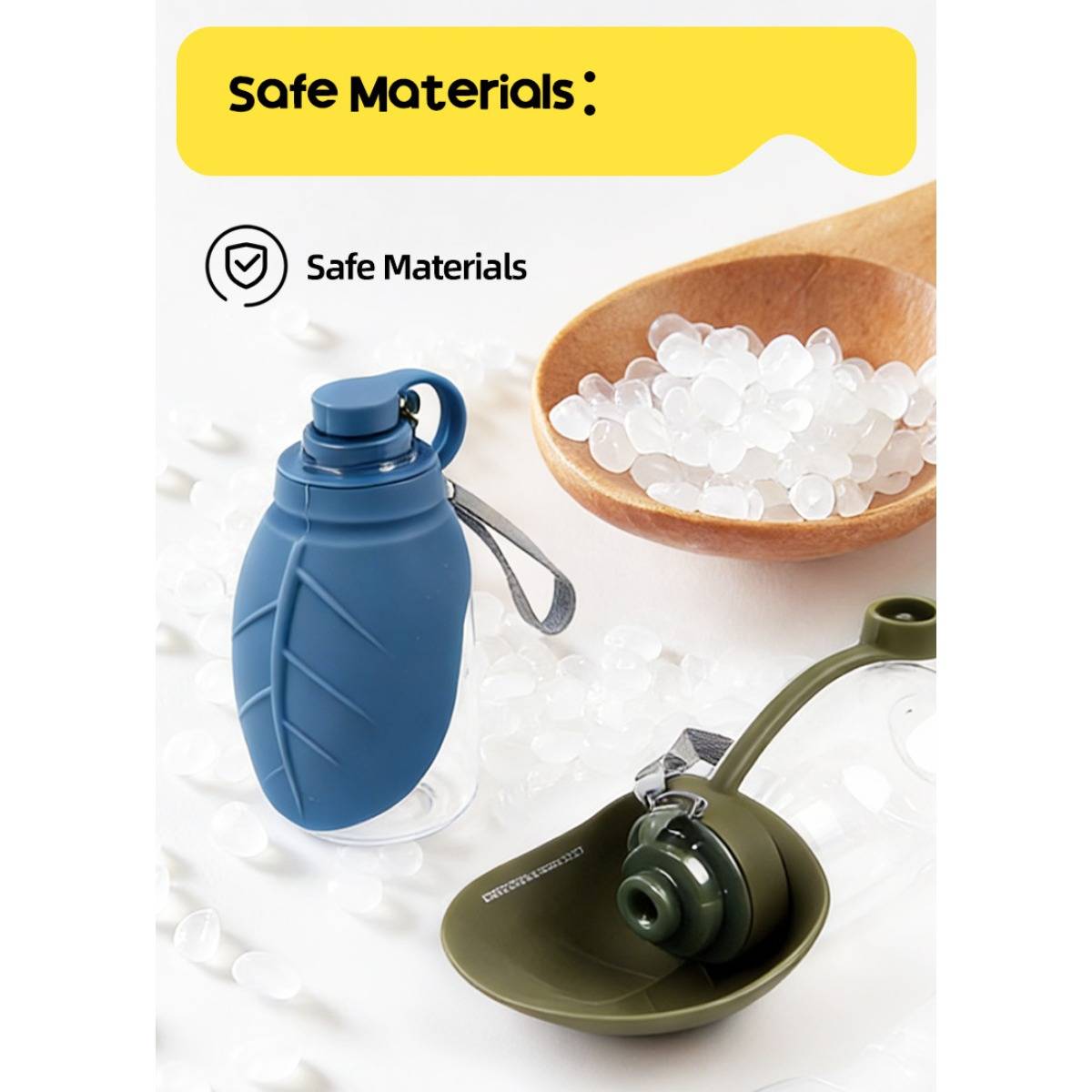 Werbebild mit der Bezeichnung „Sichere Materialien", das zwei wiederverwendbare, zusammenklappbare Wasserflaschen zeigt, eine blaue und eine olivgrüne, mit einer Holzschüssel mit Pellets im Hintergrund.