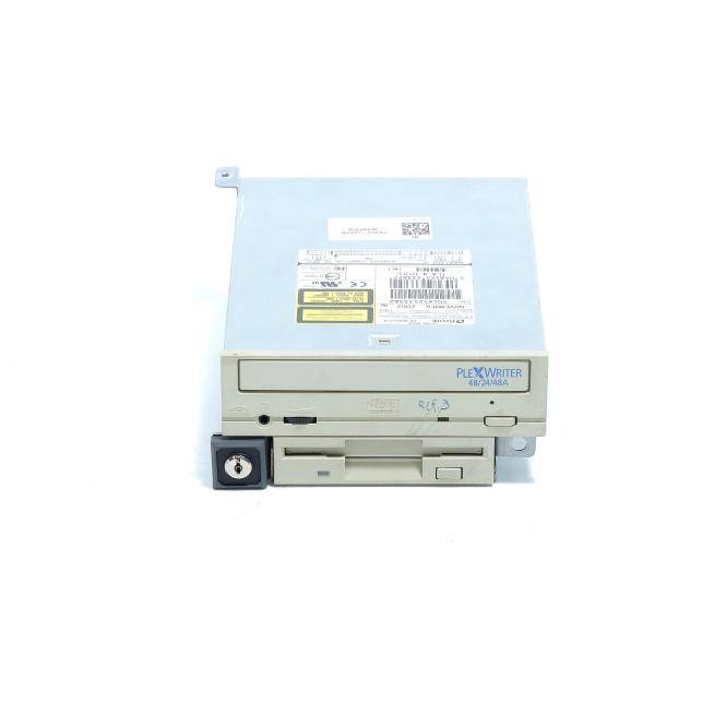 Vorderansicht eines PLEXWRITER-Diskettenlaufwerks mit beigefarbiger Frontplatte, Metalldeckel, Etikettenaufklebern und einem Schlüsselsperrschloss unten links.