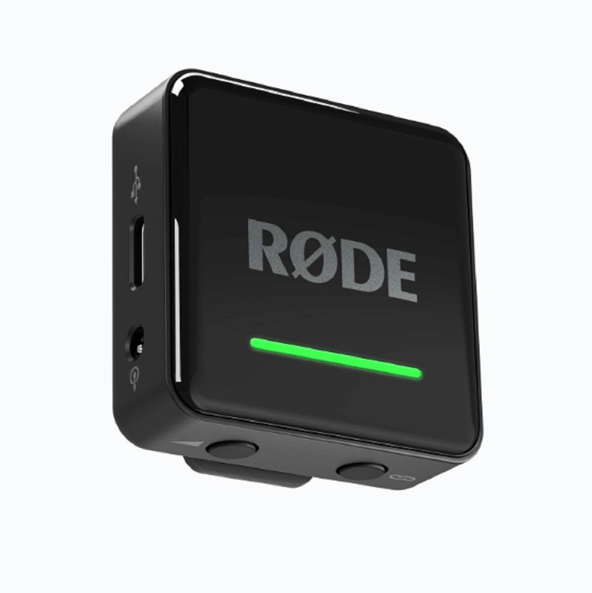 Kompaktes schwarzes RØDE Audio-Gerät mit leuchtender grüner Statusanzeige, gezeigt in einer Dreiviertelsansicht auf weißem Hintergrund.