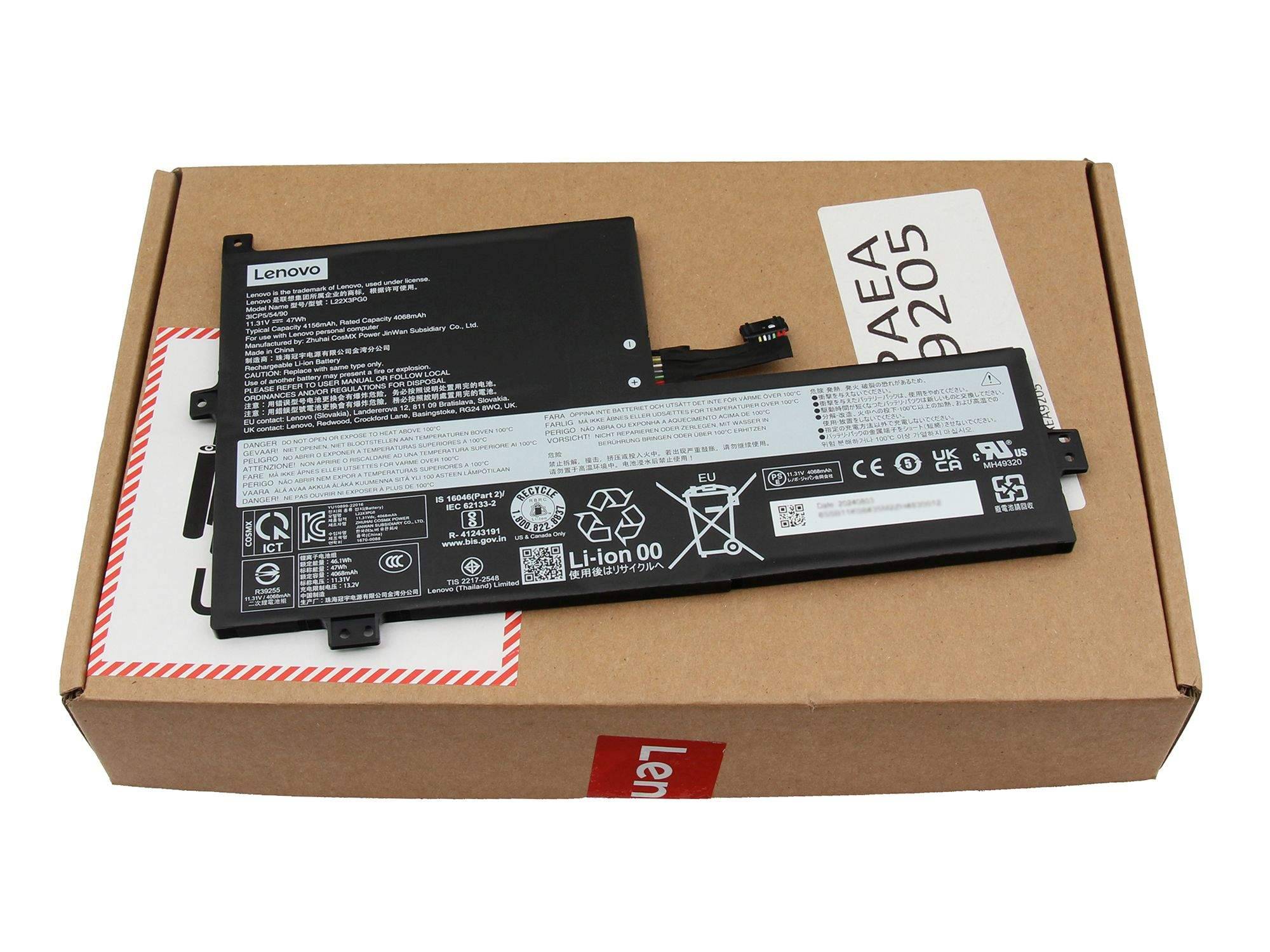 Zwei Lenovo-Laptop-Batterien ruhen auf einer Pappe, eine mit der Bezeichnung Li-ion 00 und eine schwarze Batteriebaugruppe mit Spezifikationen.