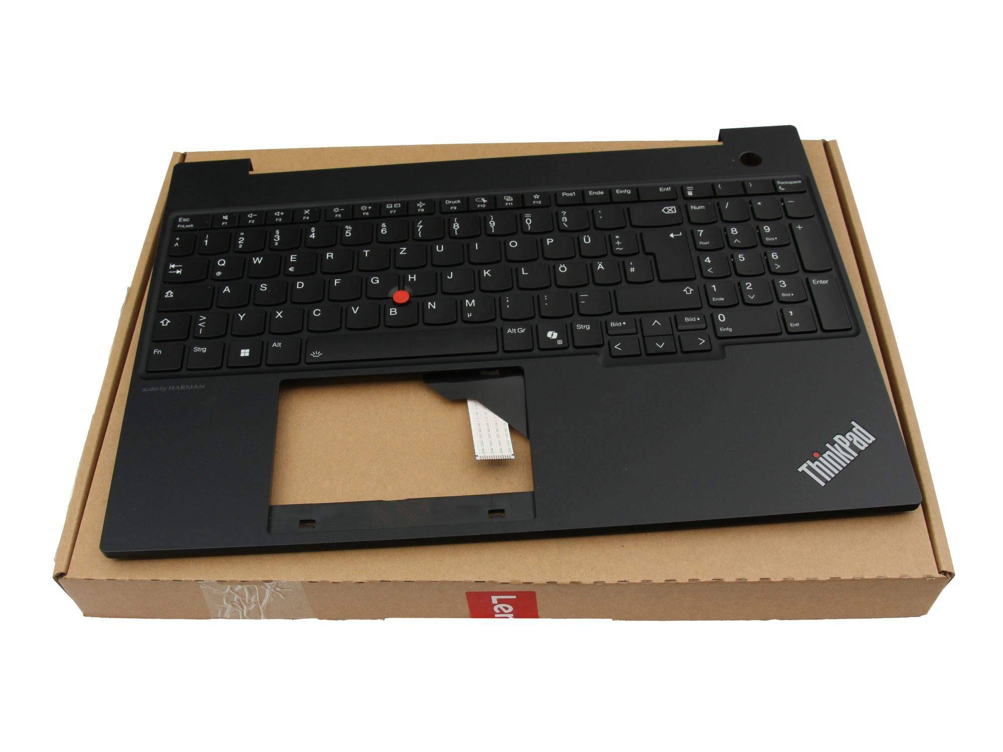 Schwarze ThinkPad-Laptop-Tastatur und Handballenablage auf einer Kartonschachtel gezeigt, mit sichtbarem Touchpad und rotem TrackPoint.
