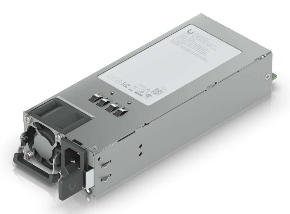 Ein silbernes Hot-Swap-Stromversorgungsmodul mit Kühlventilator und Stecker, gezeigt in einer Dreiviertelvorderansicht auf weißem Hintergrund.