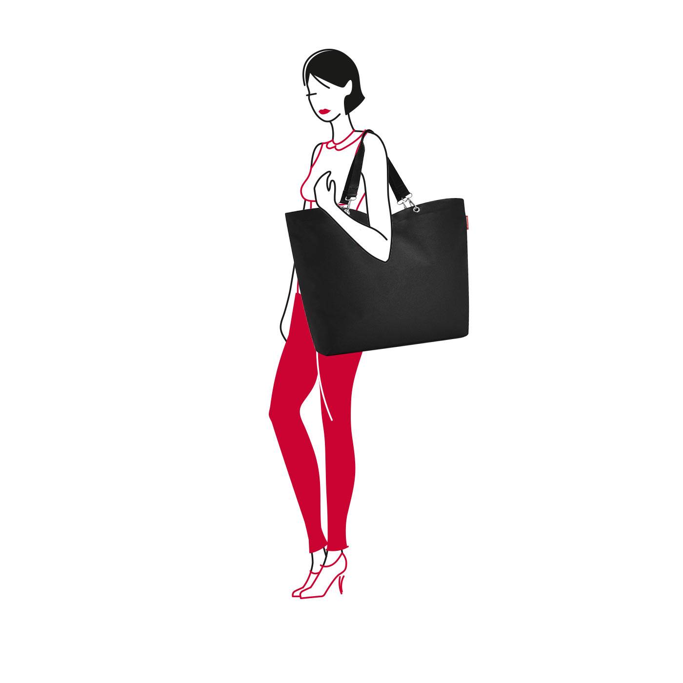 Stilisierte Illustration einer modisch gekleideten Frau in roten Hosen und Absatzschuhen, die eine große schwarze Shopper-Tasche vor weißem Hintergrund trägt.