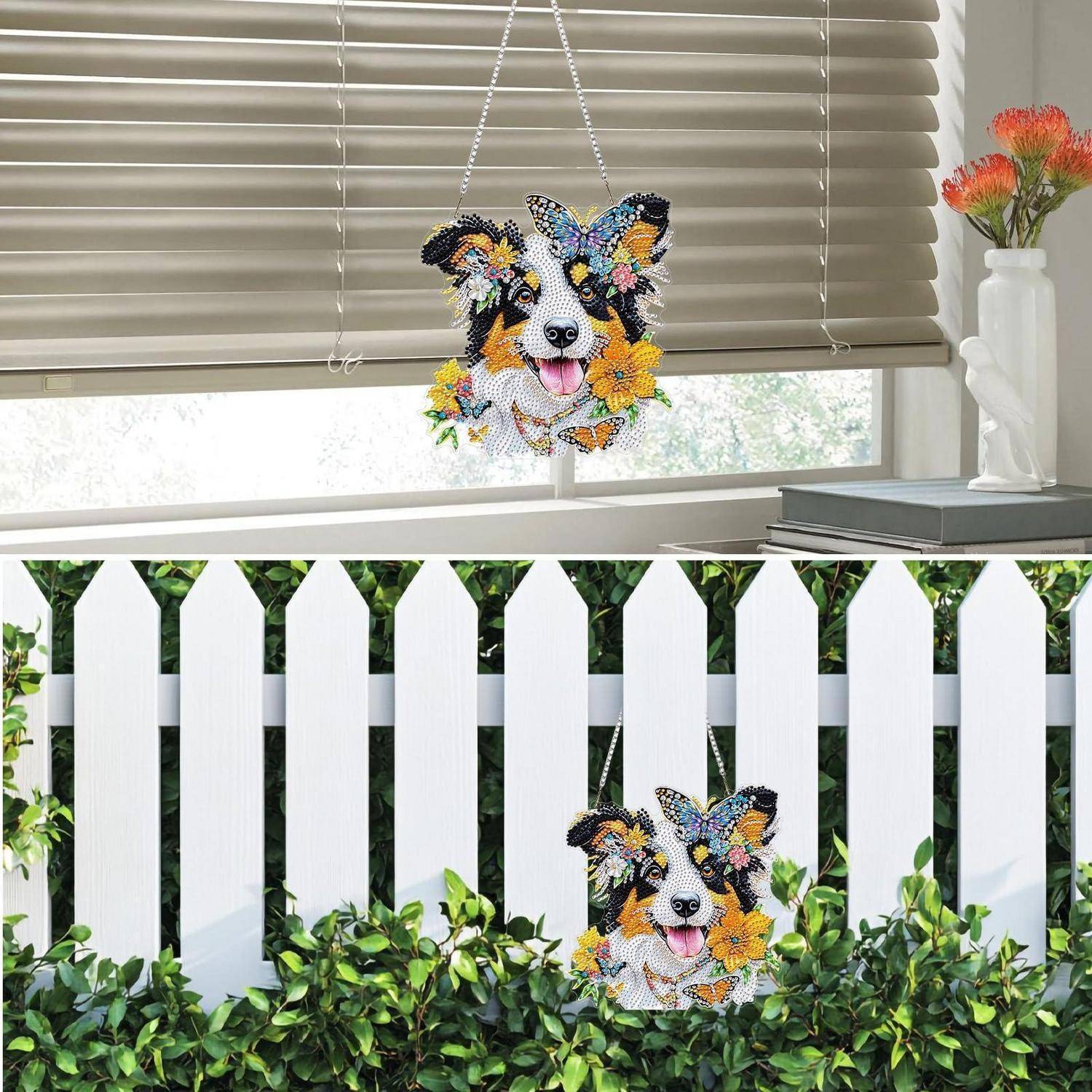 Dekoratives Hundegesicht-Sonnenfänger mit Blumen, gezeigt hängend in einem Fenster und ausgestellt auf einem weißen Lattenzaun in einem Garten.