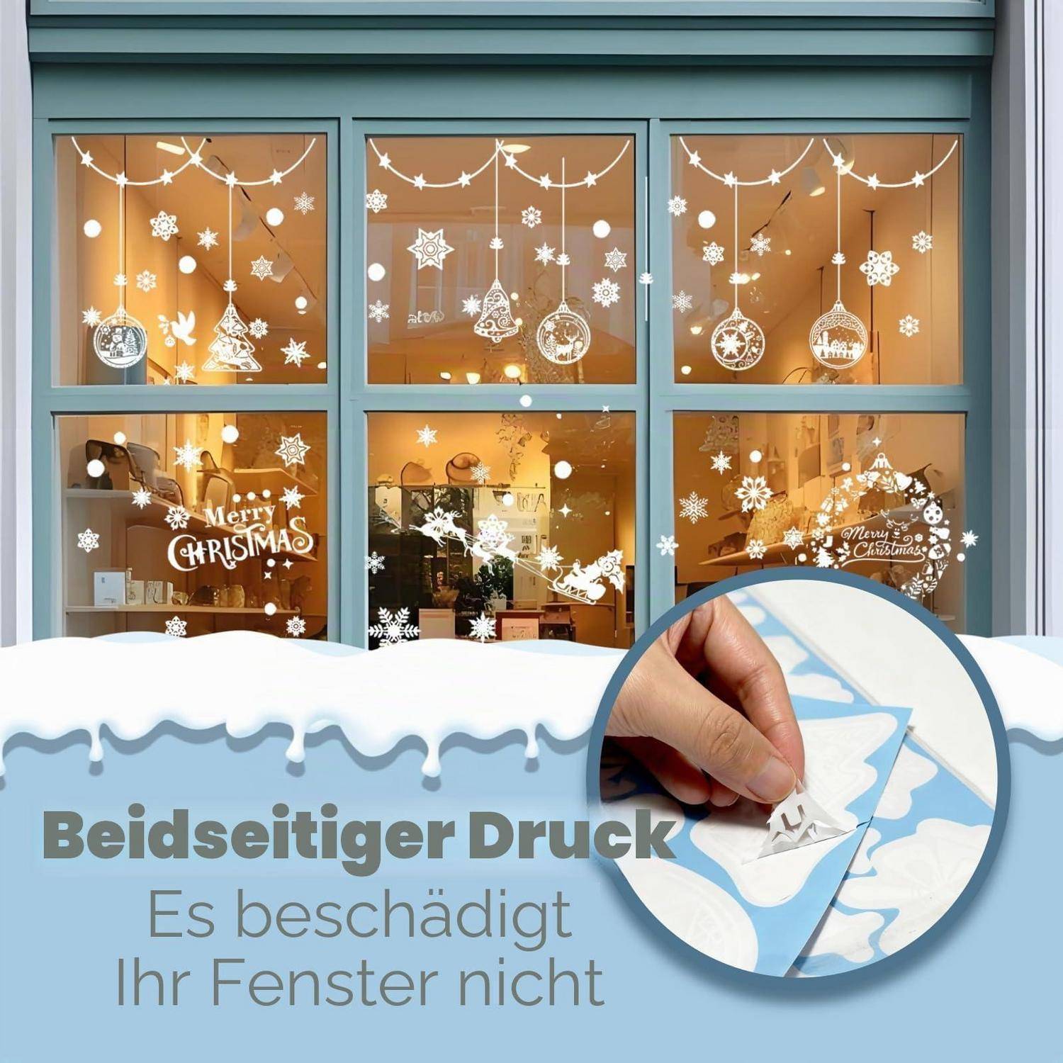 Winterfensterdekale mit Schneeflocken und hängenden Verzierungen in Schaufenstern; der Text besagt „Beidseitiger Druck" und „Es beschädigt Ihr Fenster nicht"" mit einer Nahaufnahme beim Abziehen des Aufklebers von Glas.