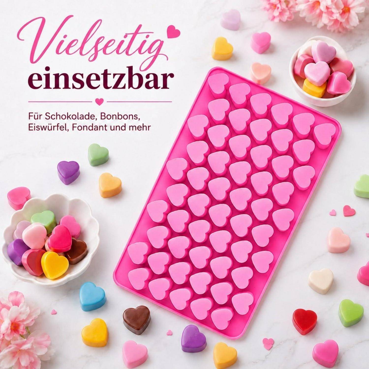 Herzförmige rosa Silikonform mit Bonbons und deutschem Text „Vielseitig einsetzbar" präsentiert, was anzeigt, dass sie für Schokolade, Bonbons, Eiswürfel, Fondant und mehr verwendbar ist.