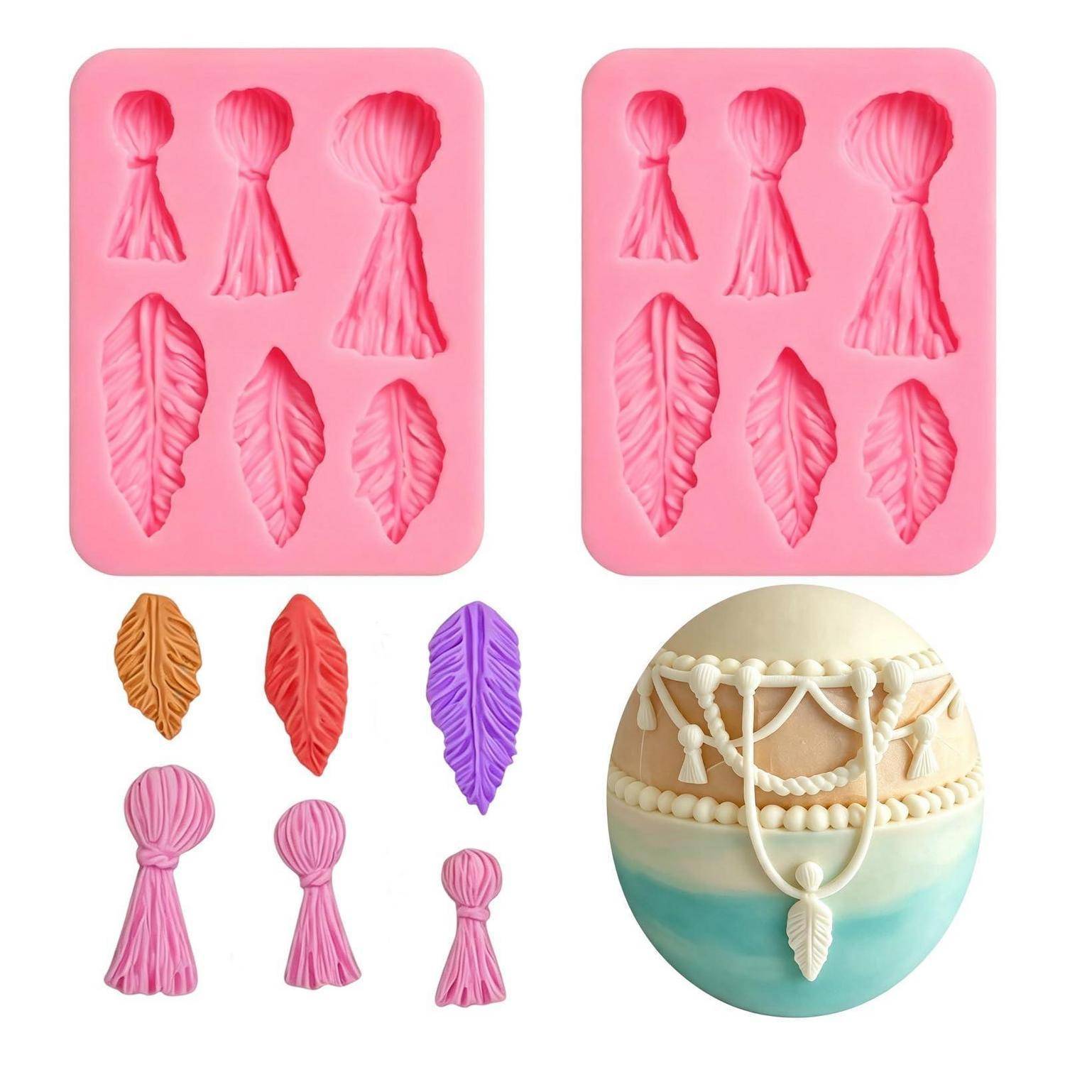 Satz aus Silikonformen und fertigen Fondantdekorationen in Form von Quasten und Blättern, plus ein dekoriertes Ei mit perlenbesetzter Drapierungsverzierung.