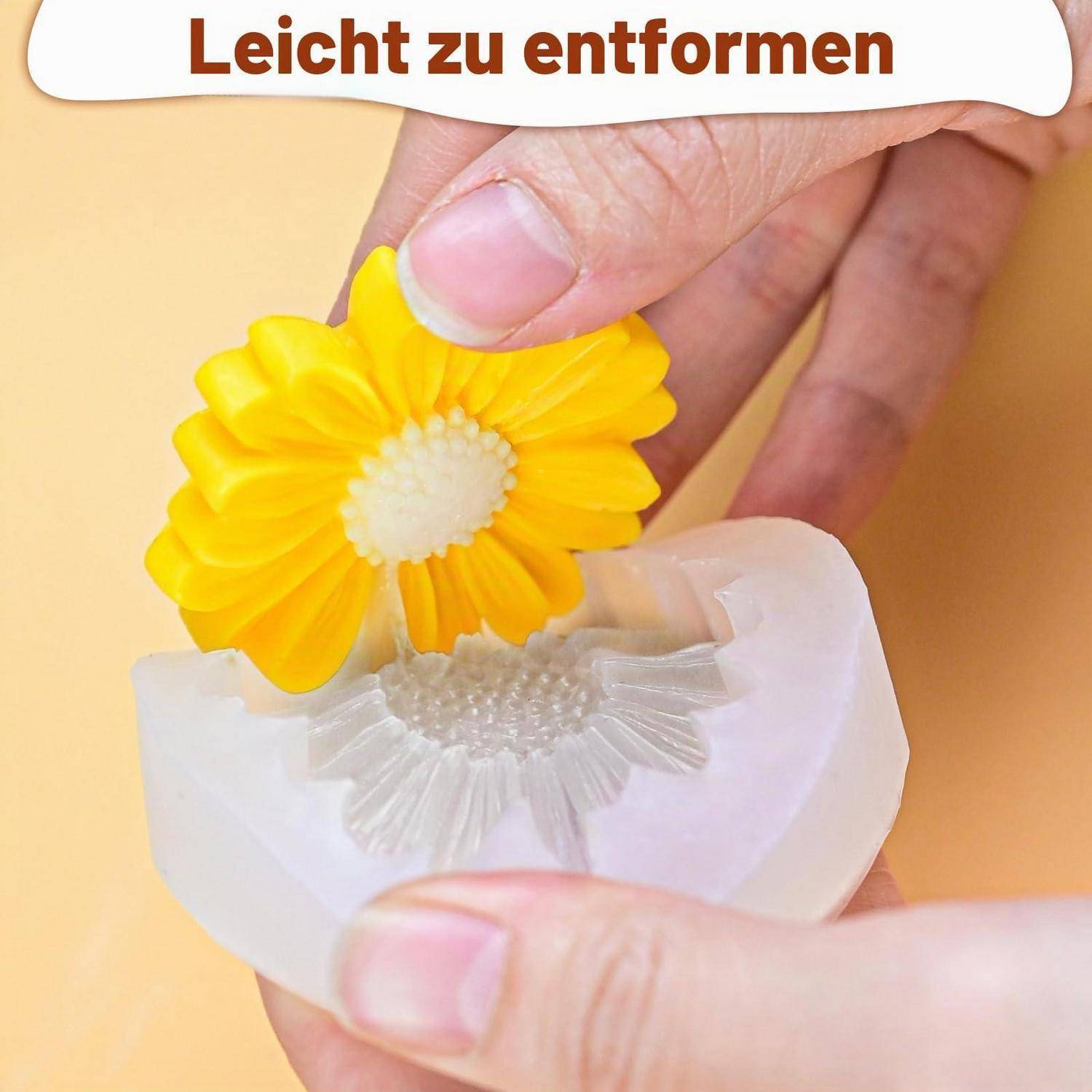 Hände formen eine gelbe Blumenform mit einer weißen abnehmbaren Basis; Text lautet 