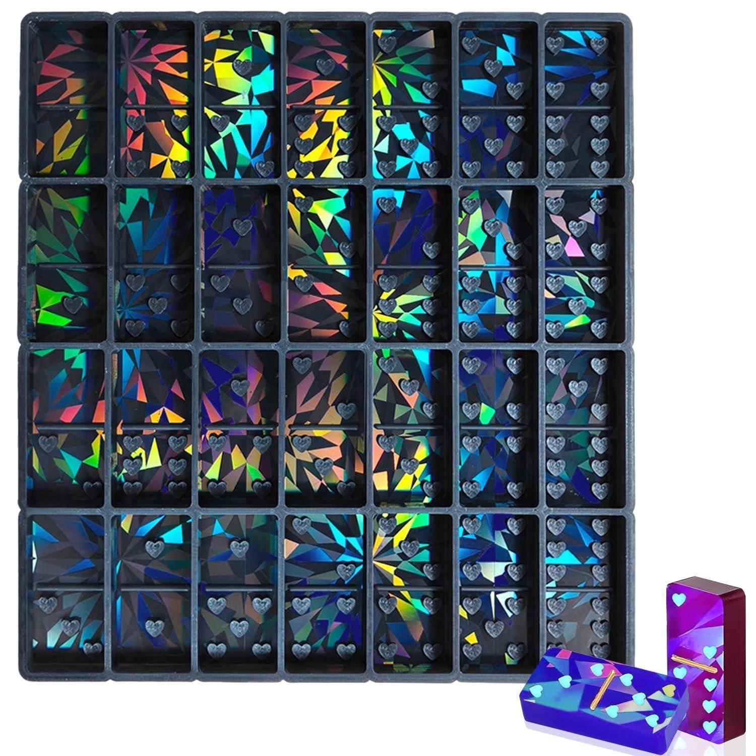 Ein Set farbenfroher holografischer Nagel-Kunstaufkleber in schwarzen Fachabteilungsschalen, mit zwei Muster-Aufkleberkästen unten rechts dargestellt.