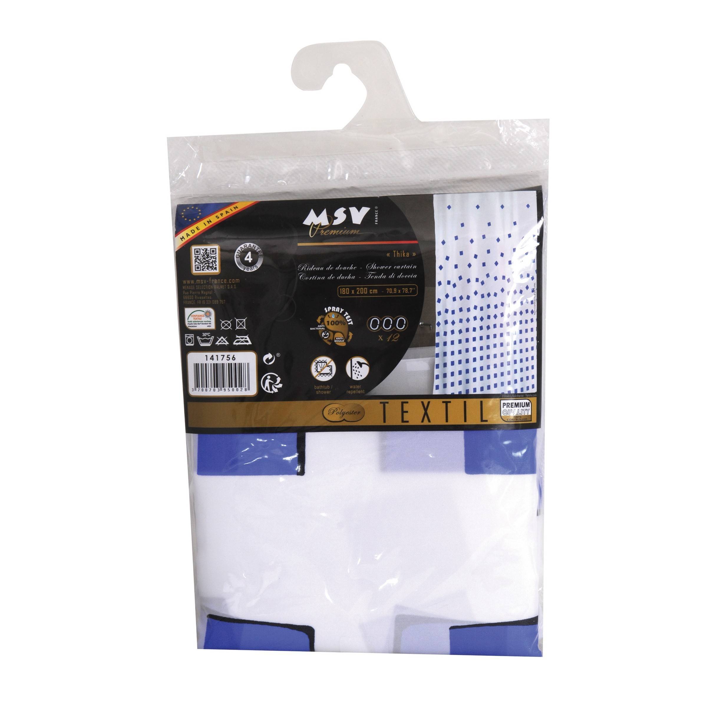 Verpacktes weißes Textil mit blauem Rand und einem blauem Punktemuster-Bereich, präsentiert in durchsichtige Einzelhandelverpackung mit den Bezeichnungen 'TEXTIL' und 'MSY'.