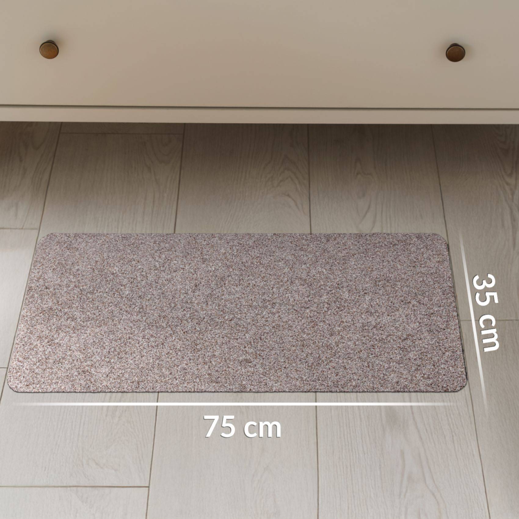 Graue rechteckige Bodenmatte, die auf einem Holzboden gezeigt wird, beschriftet mit 75 cm breit mal 35 cm hoch.