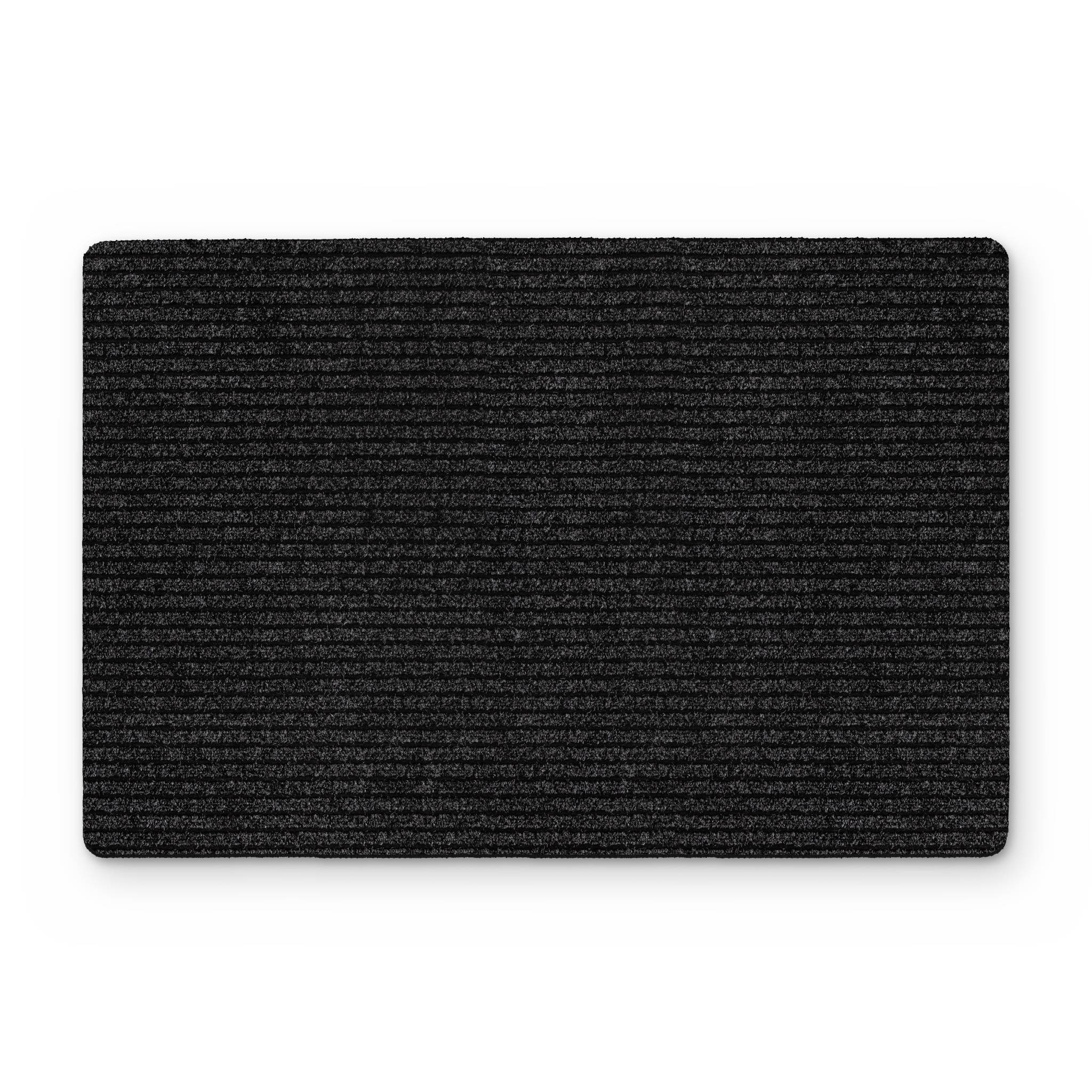 Schwarze rechteckige strukturierte Matte oder Teppichfliese auf weißem Hintergrund.