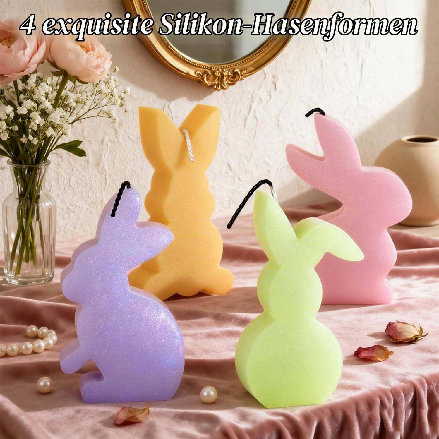 Vier bunte kaninchenförmige Silikonkerzen auf einer rosa Satinoberfläche, mit deutschem Text „4 exquisite Silikon-Hasenformen