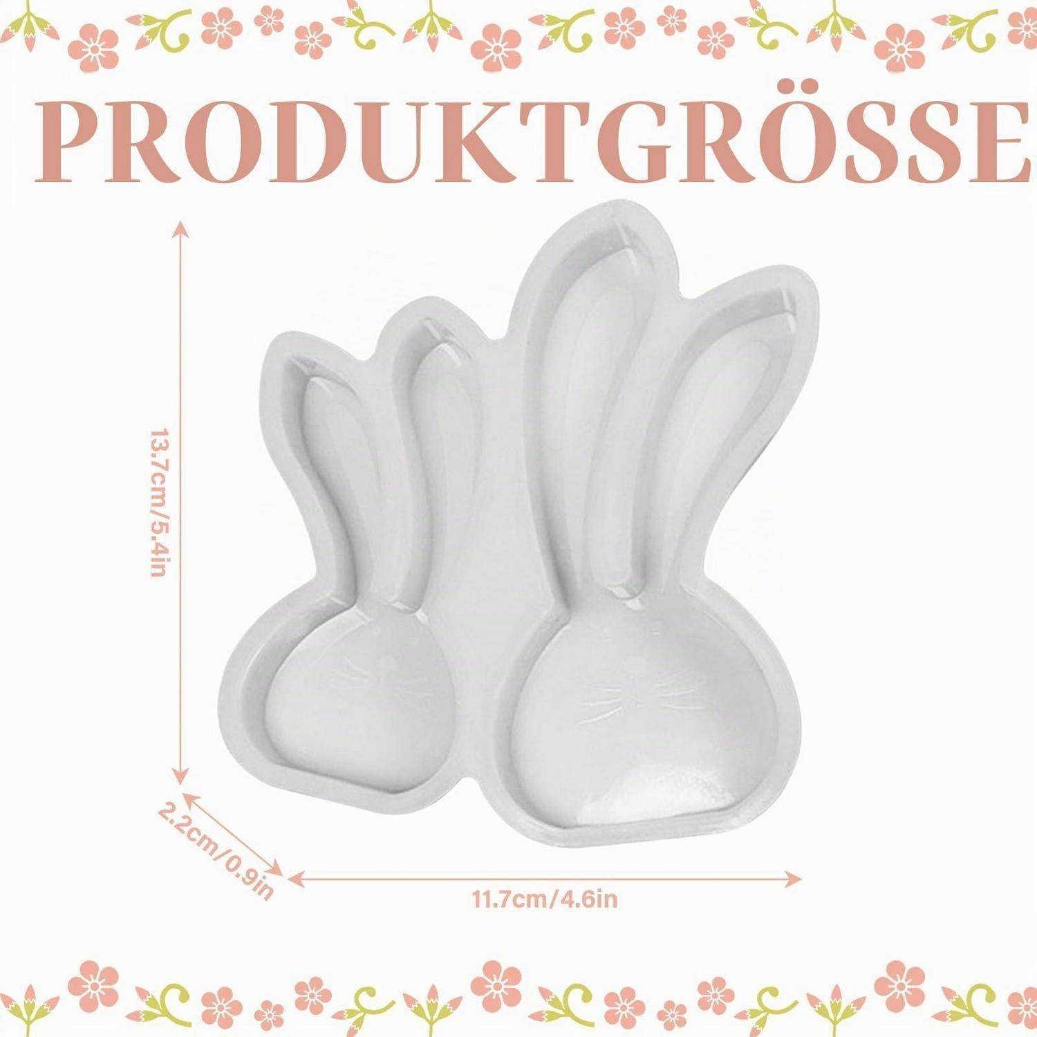 Produktgrößen-Grafik zeigt zwei weiße kaninchenförmige Artikel mit der Bezeichnung "PRODUKTGRÖSSE"" und den Abmessungen 13,7 cm x 11,7 cm x 2,2 cm.