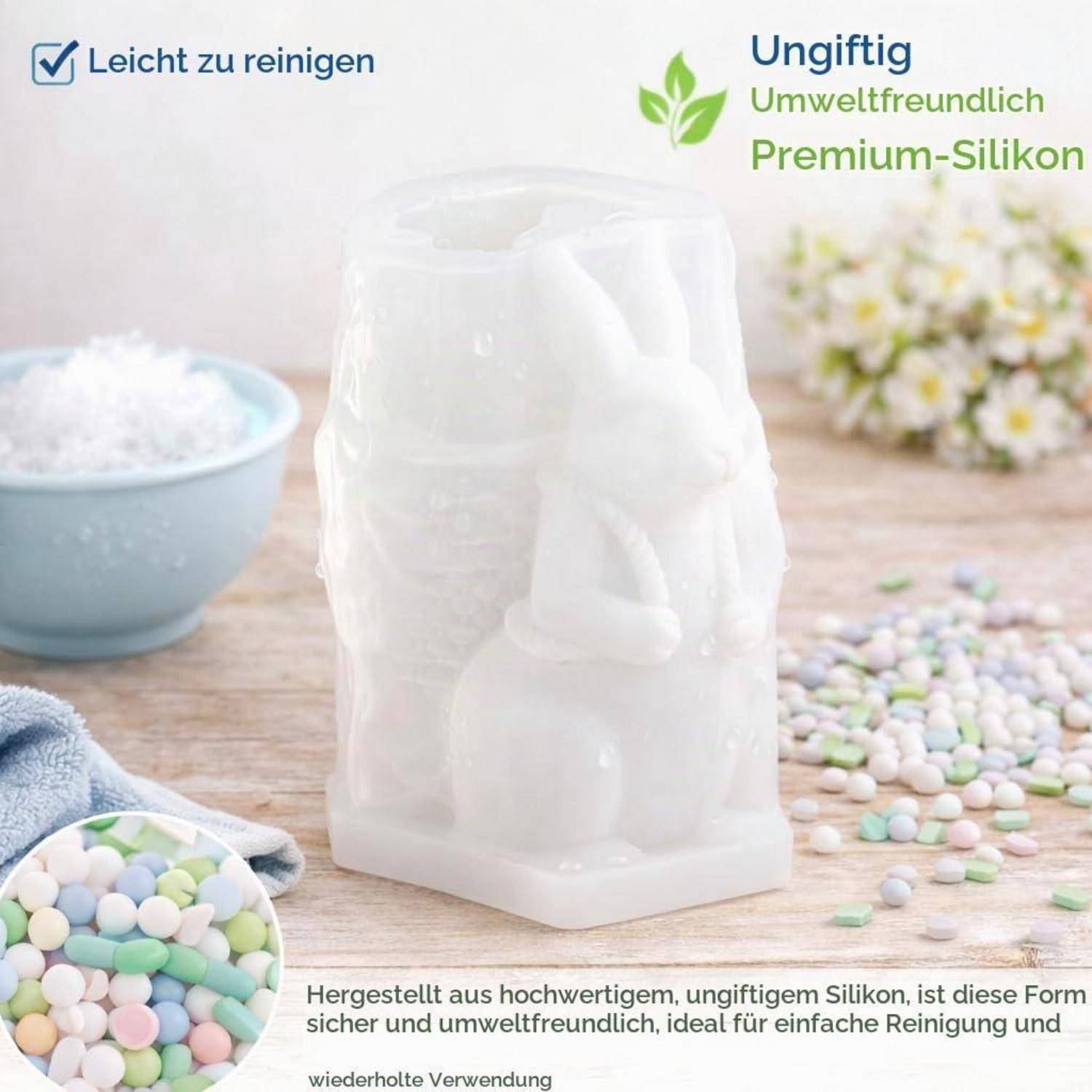Weiße Premium-Silikonform auf einem Tisch mit Pastell-Süßigkeiten; der deutsche Text sagt „Leicht zu reinigen", „Ungiftig"", „Umweltfreundlich"" und „Premium-Silikon"".