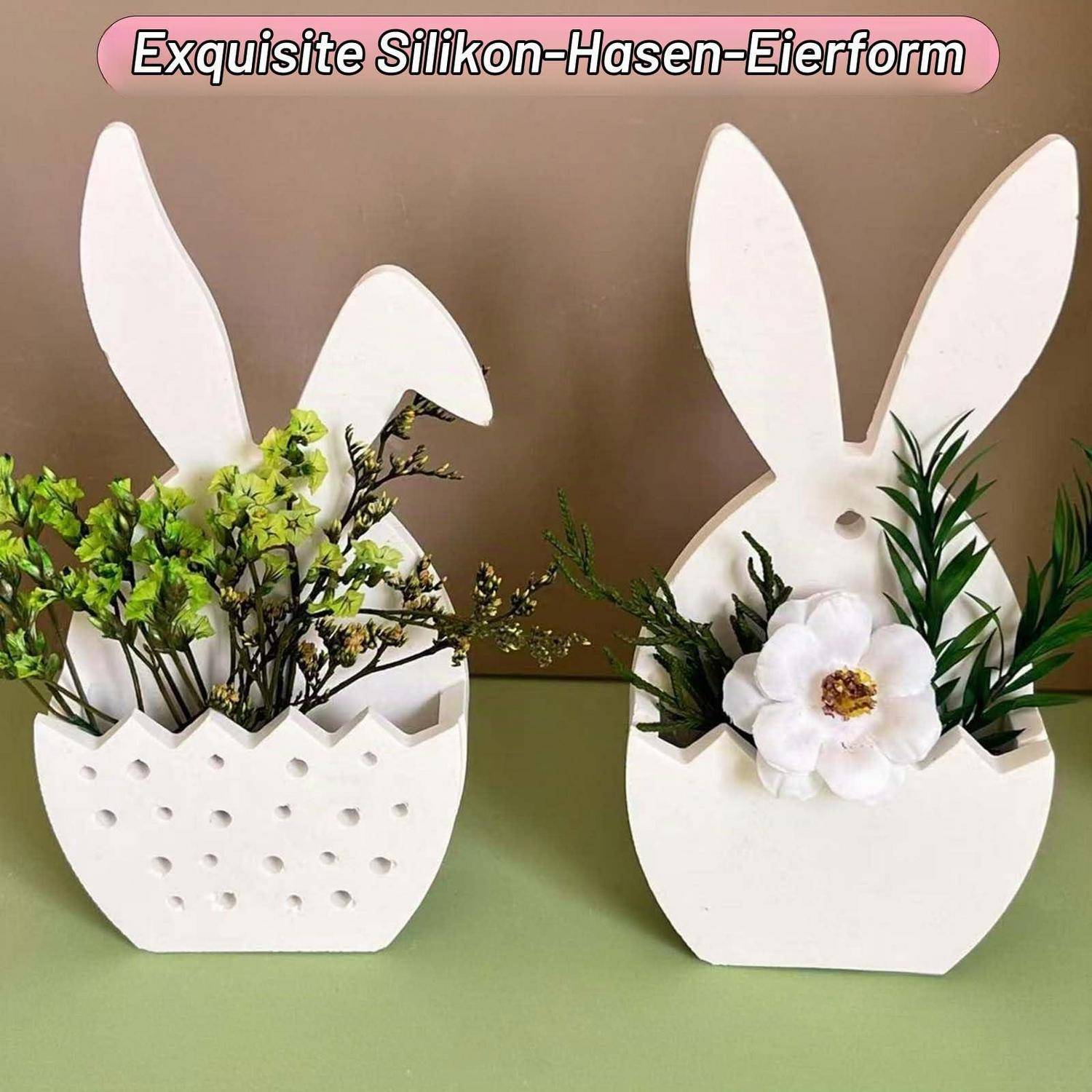 Zwei weiße kaninchenförmige dekorative Blumenkübel, einer gefüllt mit Blumen und Grünpflanzen, gezeigt als Silikonform-Beispiele mit Text „Exquisite Silikon-Hasen-Eiform".