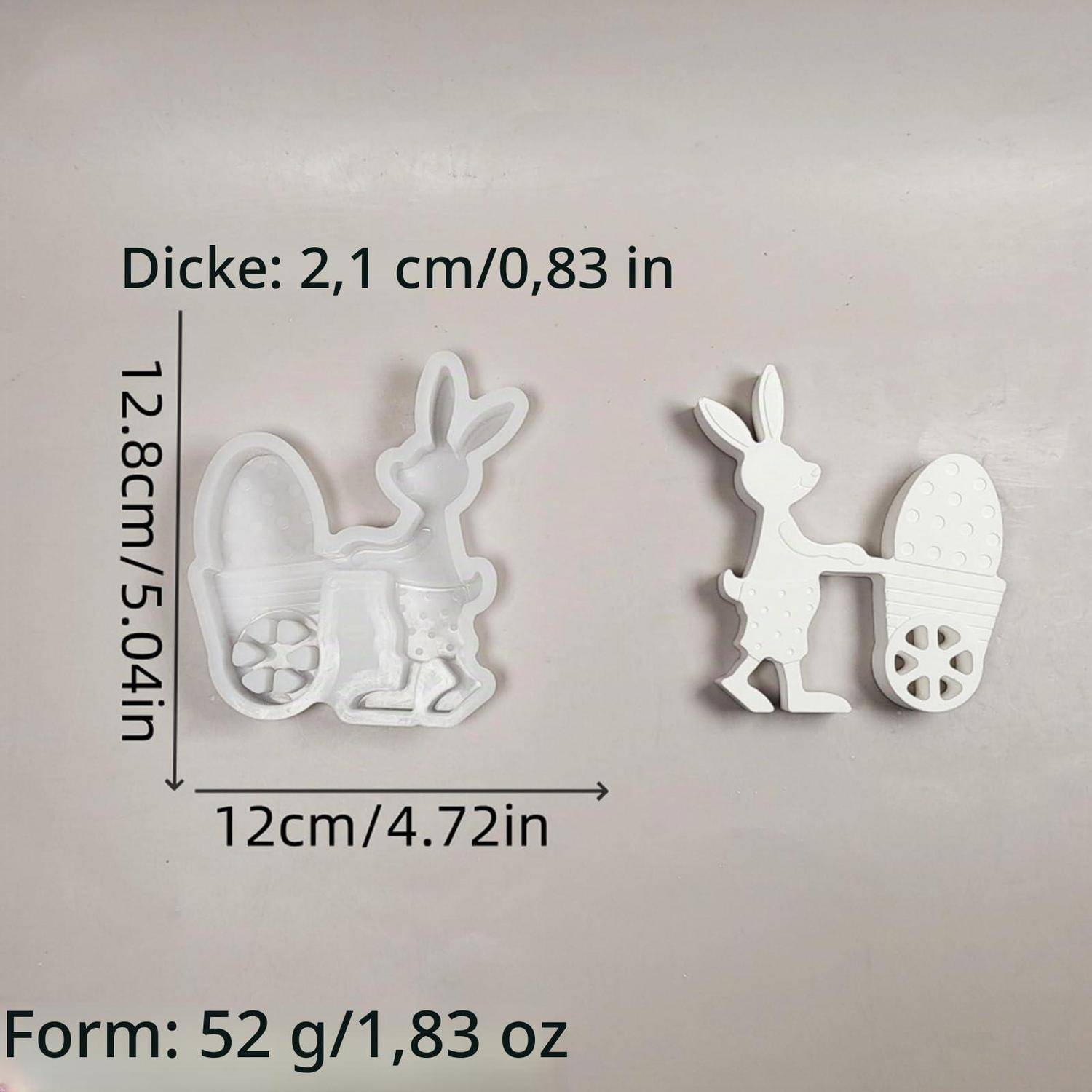 Produktgrößenabbildung eines weißen hasenförmigen Korbs/Dekors: 12,8 cm hoch, 12 cm breit, 2,1 cm dick, 52 g.