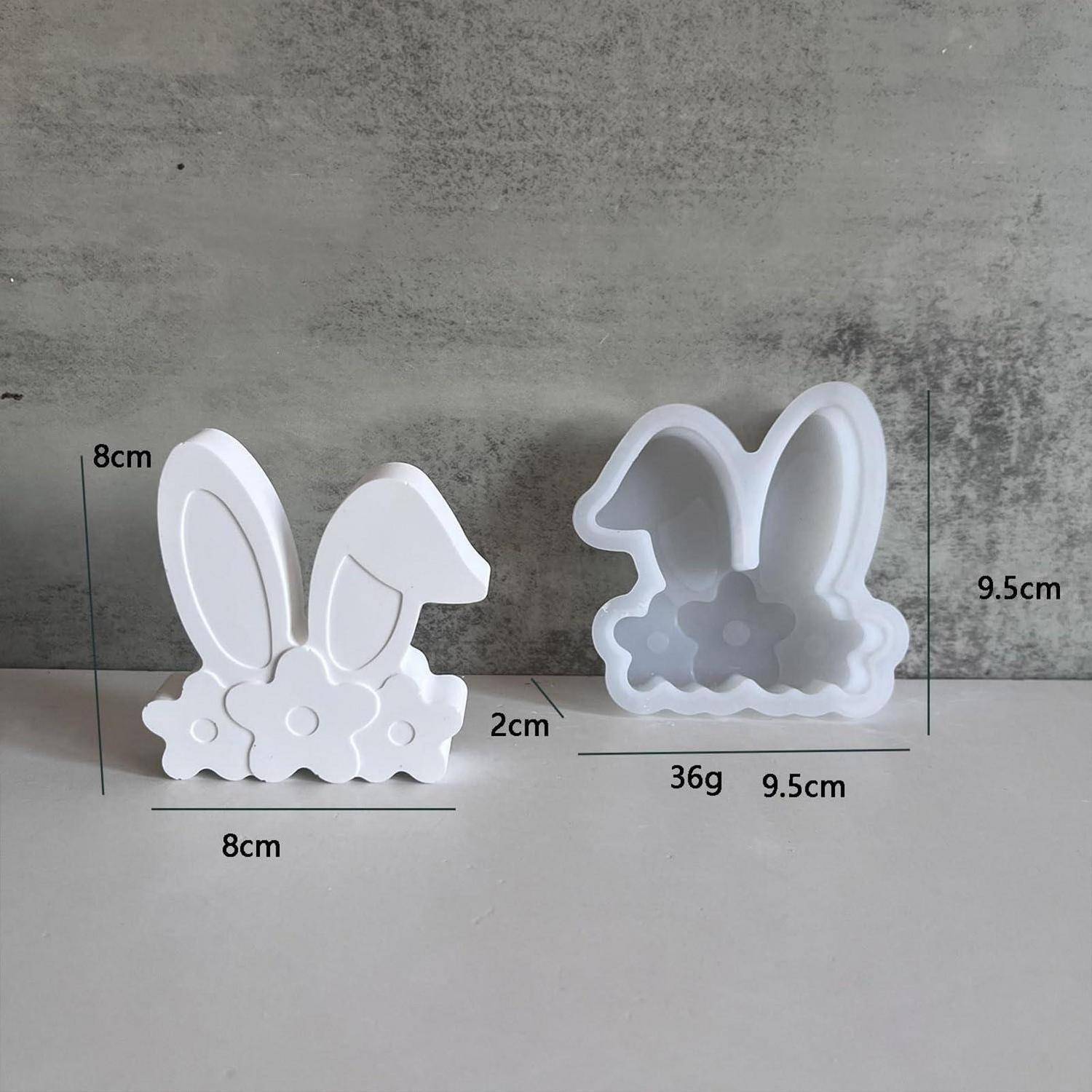 Weiße hasenförmige Silikonform von vorne und hinten gezeigt, mit beschrifteten Abmessungen von 8 cm Breite, 8 cm Höhe, 9,5 cm Höhe und 36 g.