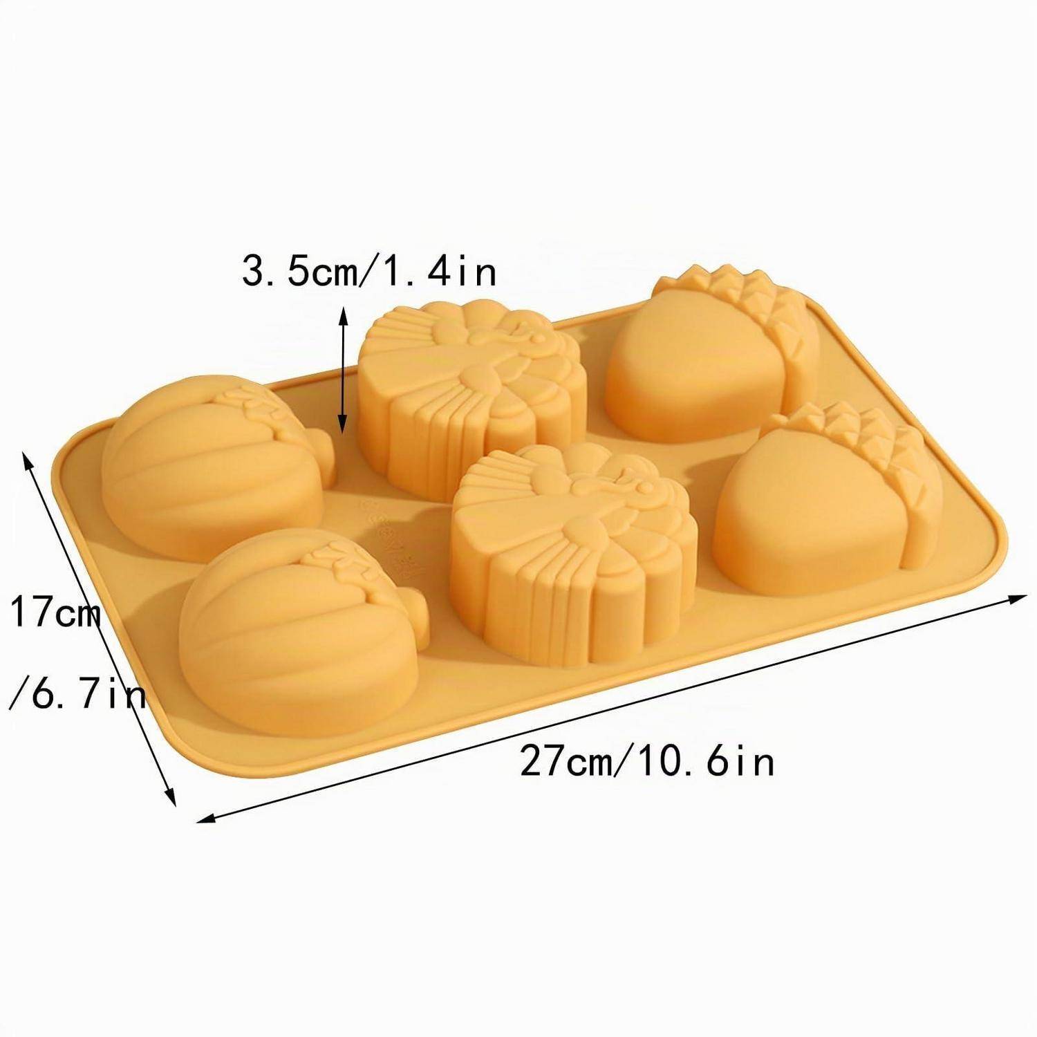 Gelbes Silikon-Backblech mit sechs Mulden in Form von Blüten und runden Formen, beschriftet mit 27 cm x 17 cm und 3,5 cm Tiefe.