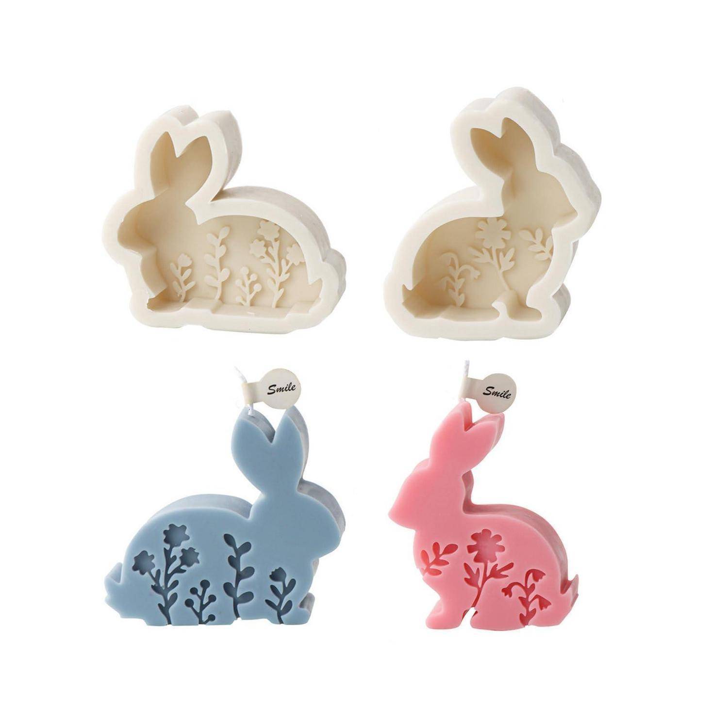Vier dekorative Kerzen oder Seifen in Kaninchenform in Creme, Blau und Rosa, jeweils mit ausgestanzten Blütendetails und zwei mit kleinen 