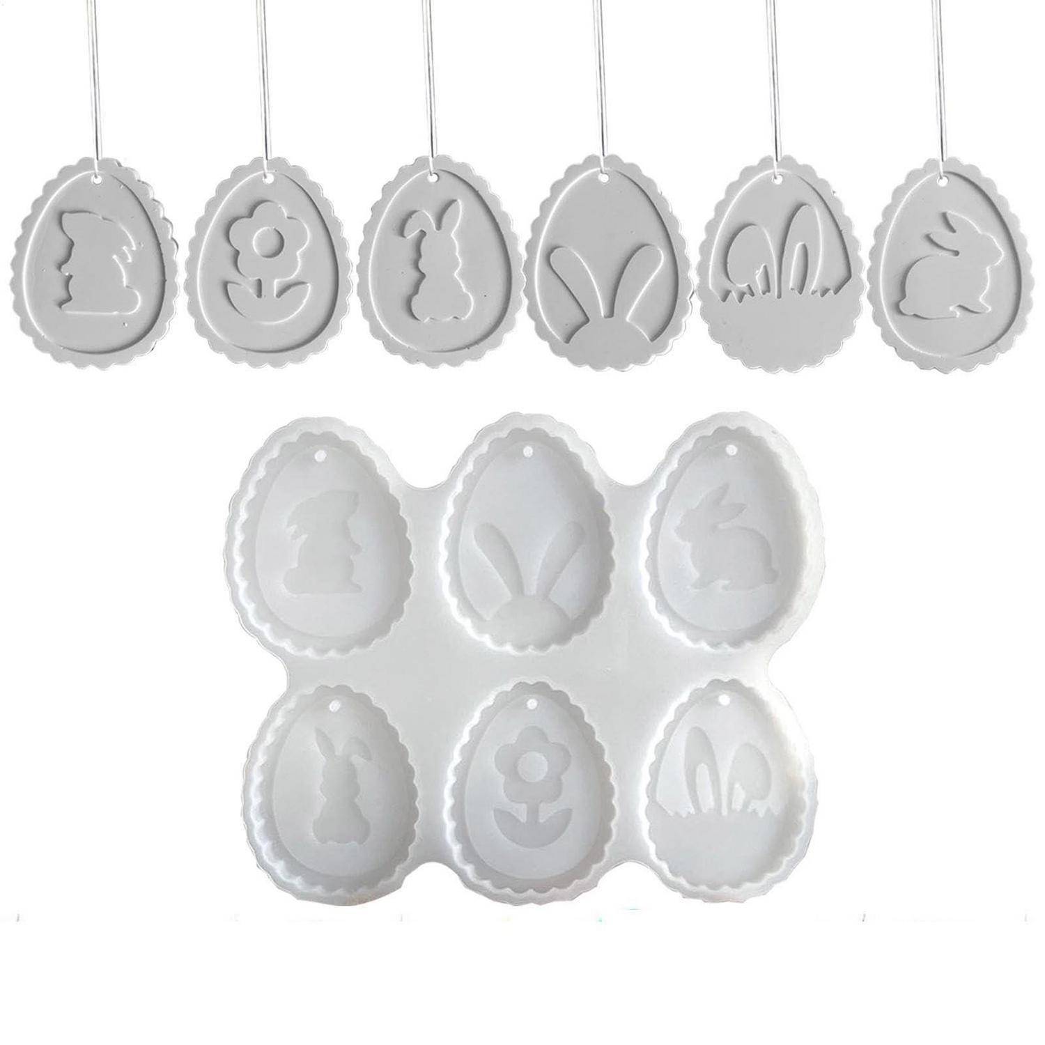Eiförmige Oster-Ornamente und passende Handwerk-Formen mit geprägten Hasen-, Blumen- und Schmetterlings-Designs.