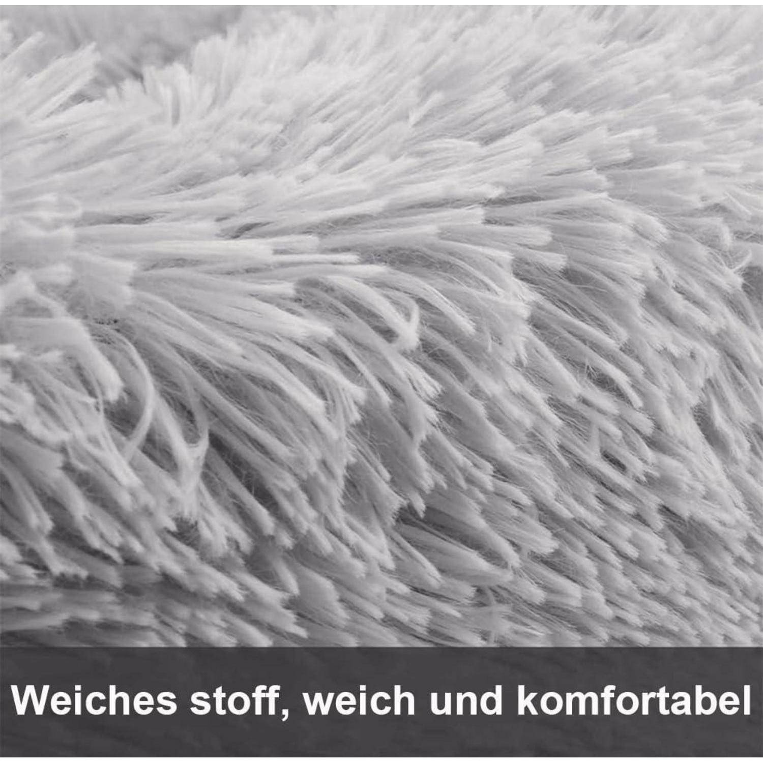 Nahaufnahme von fluffigem grauem Stoff; Beschriftung lautet „Weiches Tuch, weich und komfortabel".