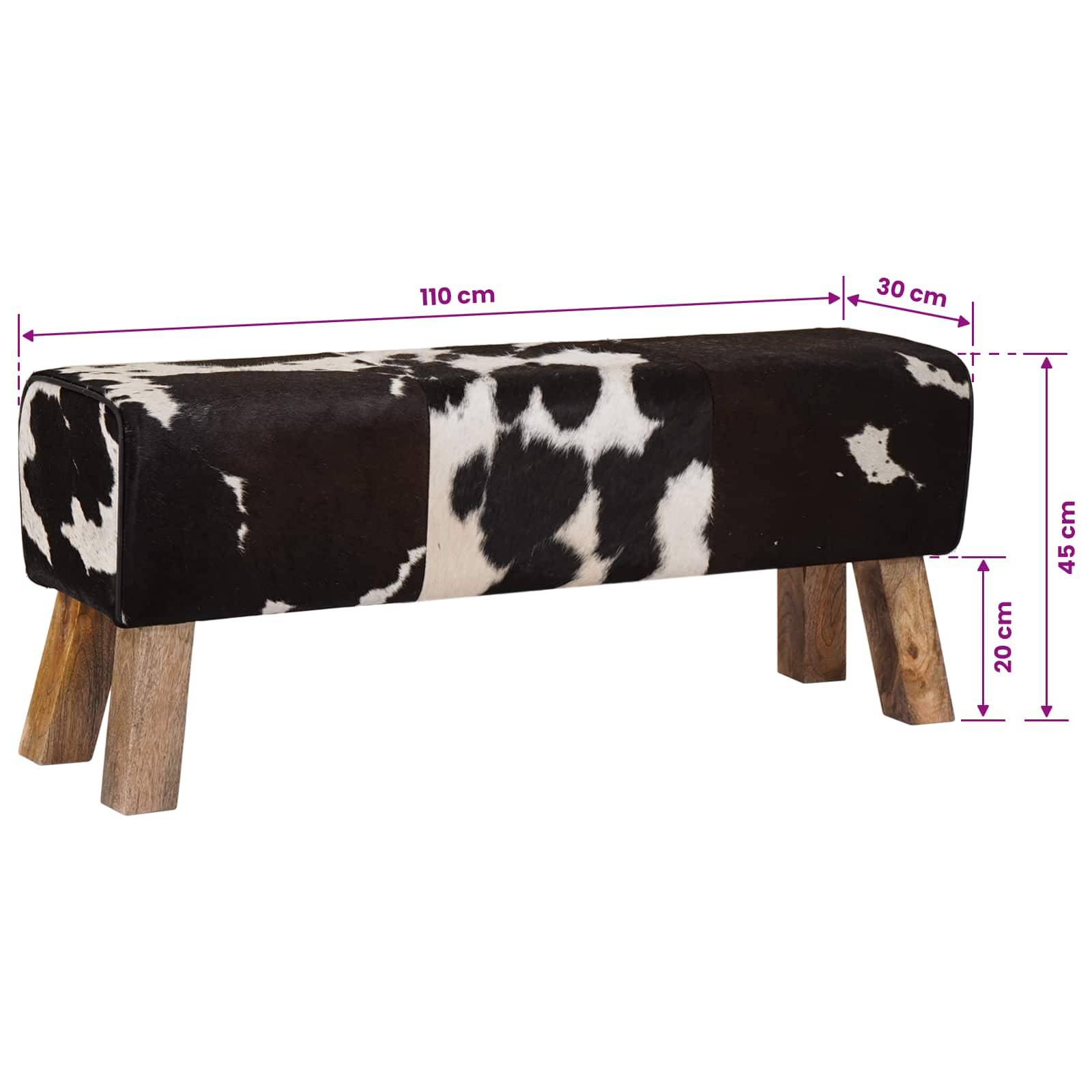 Schwarz-weiße Kuhfelderbank mit Holzbeinen, gezeigt mit Abmessungen von 110 cm Länge, 30 cm Breite und 45 cm Höhe.