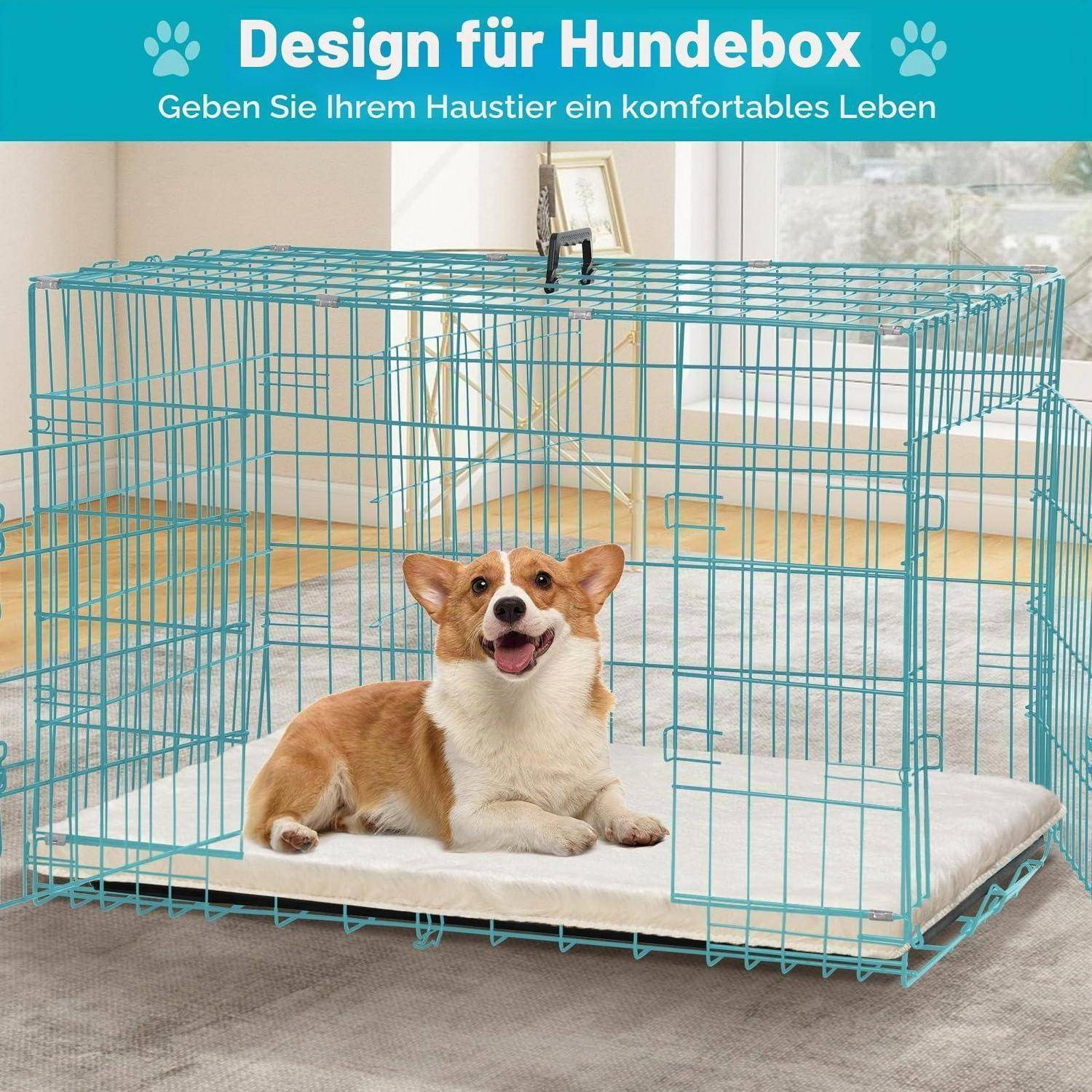 Corgi liegt auf einem weißen Kissen in einer türkisfarbenen Drahthundebox; deutscher Anzeigentext sagt „Design für Hundebox" und „Geben Sie Ihrem Haustier ein komfortables Leben"".