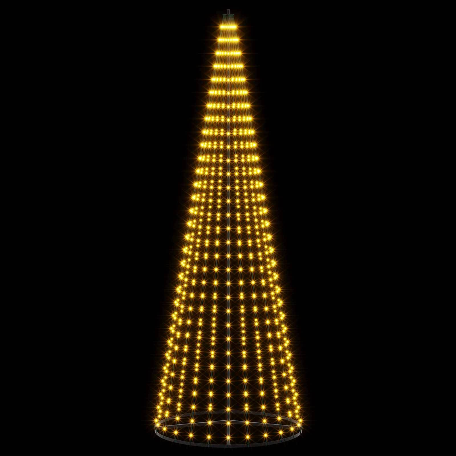Ein hoher kegelförmiger Turm aus leuchtenden goldenen Lichtern auf schwarzem Hintergrund.