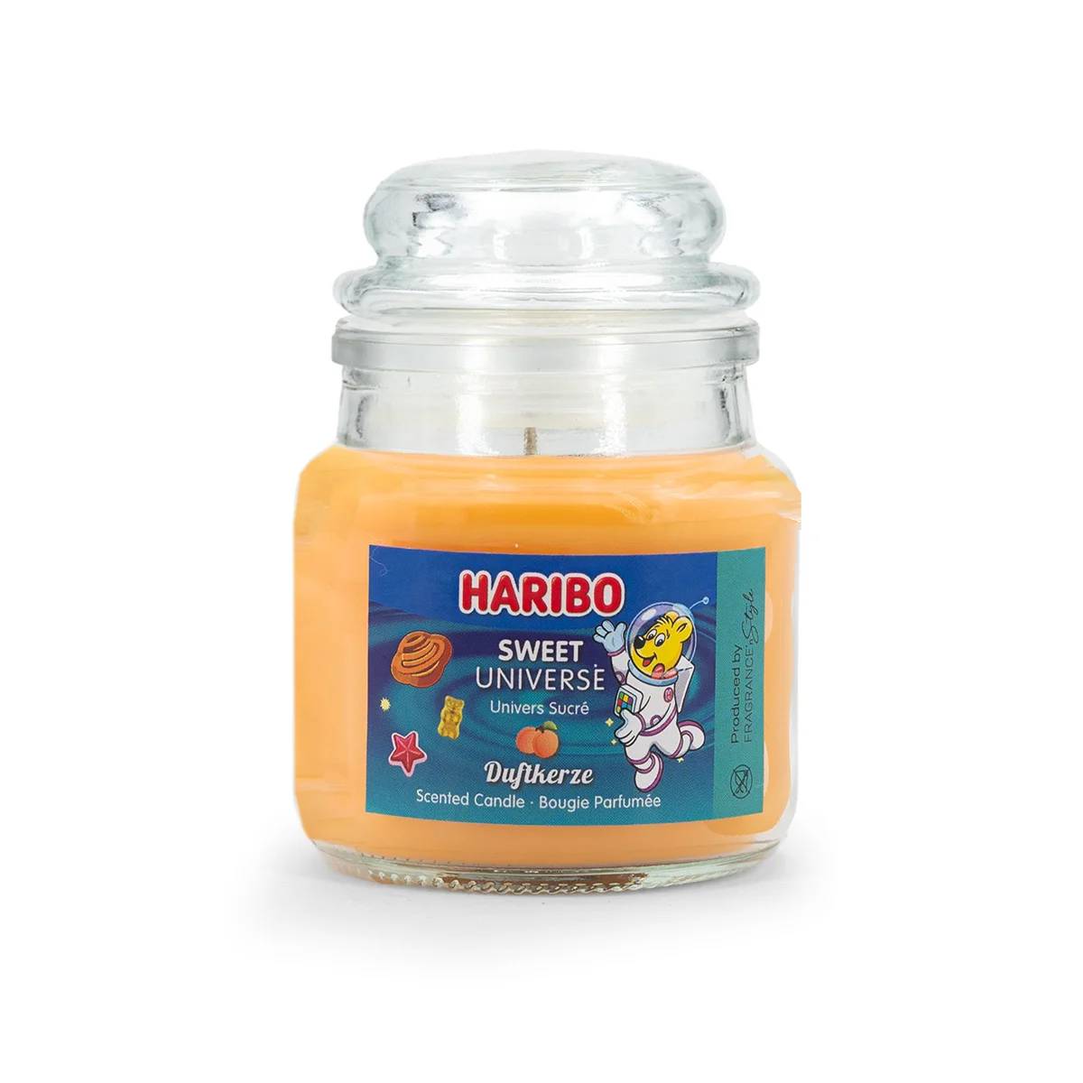Haribo Sweet Universe Duftkerze in einem Glaskrug mit orangefarbigem Wachs und farbenfrohem Etikett.