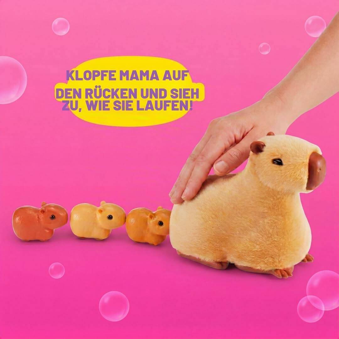Hand tätschelt eine plüschige Mutter-Capybara, während drei kleine Baby-Capybaras folgen; deutscher Text sagt „Tätschle Mama auf den Rücken und schau, wie sie läuft."