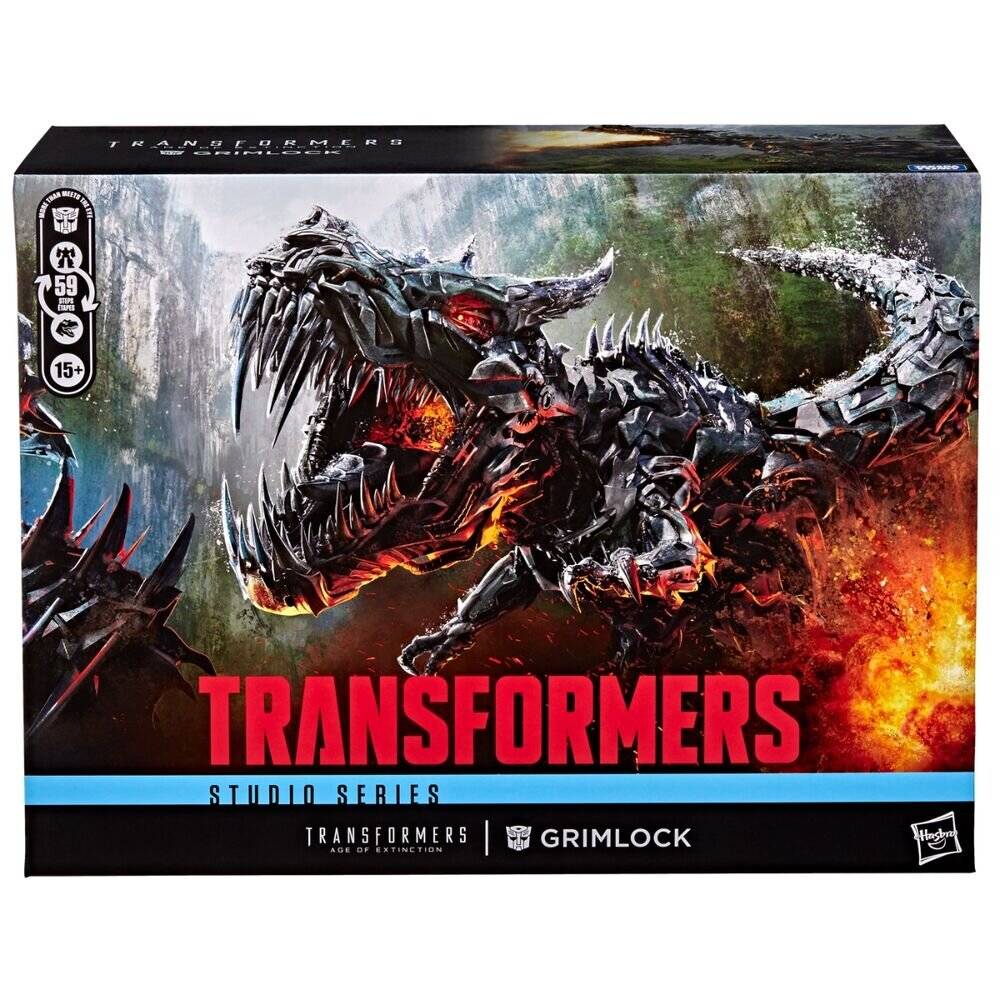 Eine Transformers Studio Series Grimlock Action-Figuren-Schachtel mit einem brüllenden Dinosaurier-Roboter, rotes „TRANSFORMERS