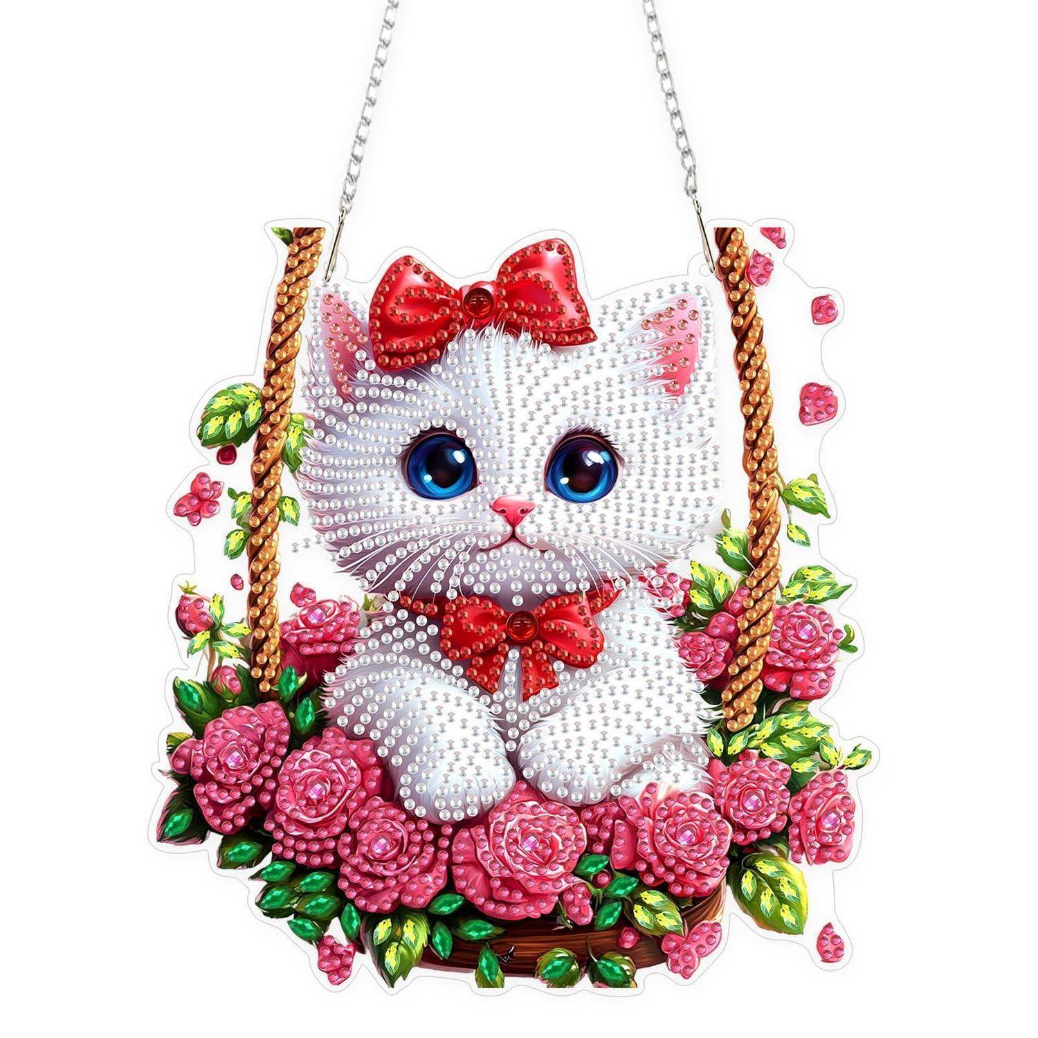 Ein süßes weißes Kätzchen mit einer roten Schleife sitzt in einem rosafarbenen Blumenkorb auf einem hängenden Ornament oder Schild, verziert mit bunten Blumendetails.