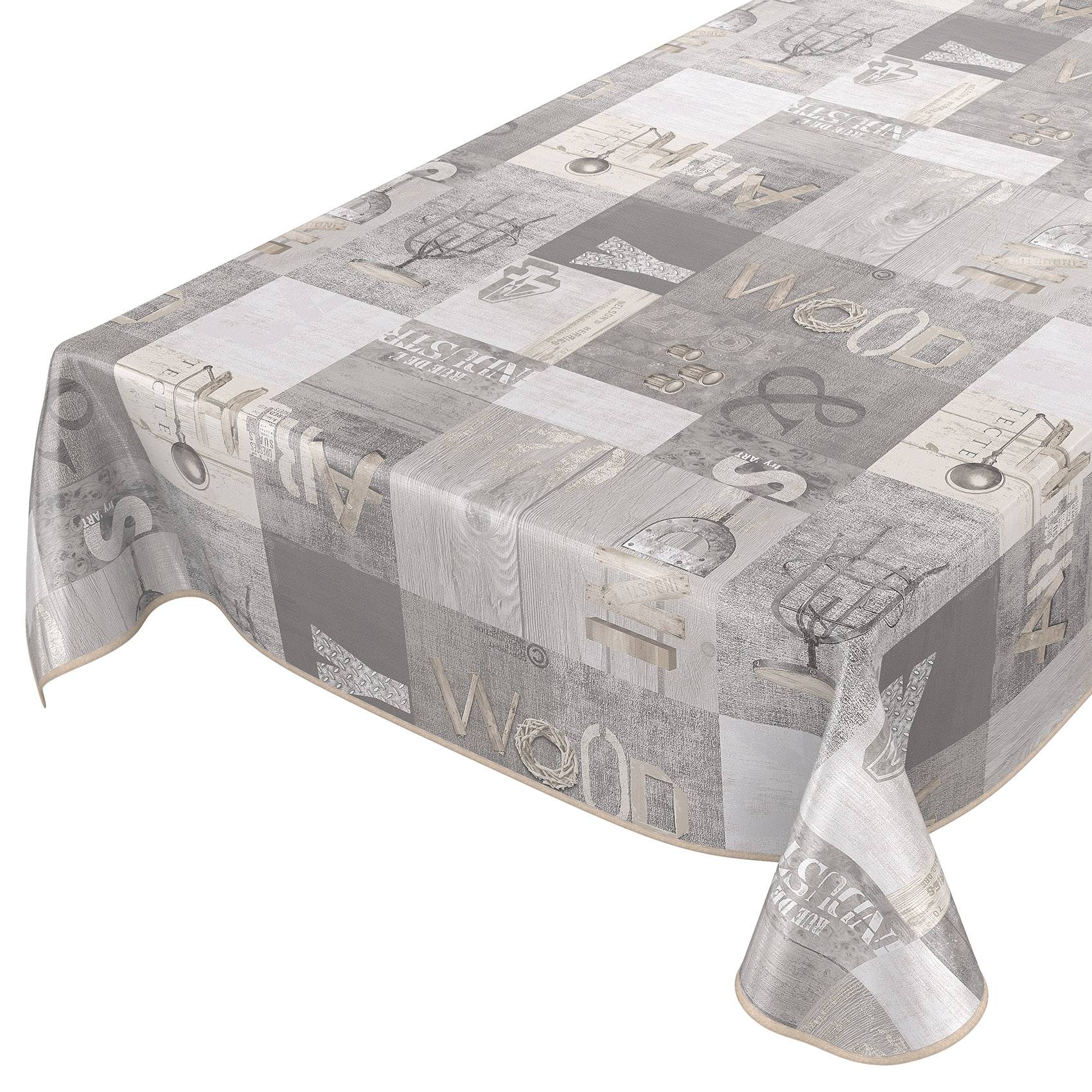 Rechteckiger Tisch mit einer grauen Tischdecke mit Muster, die Buchstaben, Zahlen und Vintage-Grafiken zeigt, über den Kanten drapiert auf weißem Hintergrund.