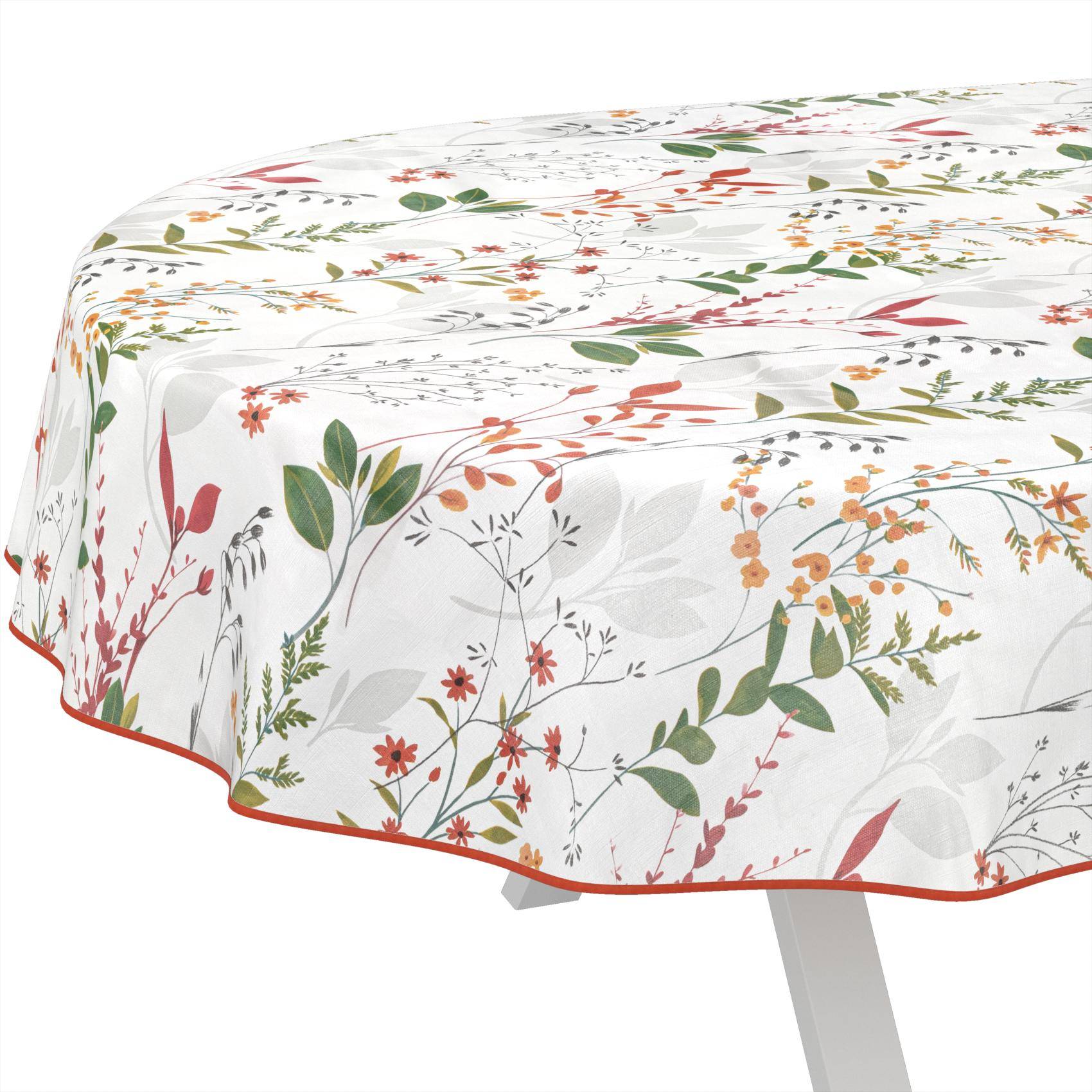 Weiße Tischdecke mit einem farbenfrohen botanischen Blumenmuster, das über die Ecke eines Tisches auf weißem Hintergrund drapiert ist.