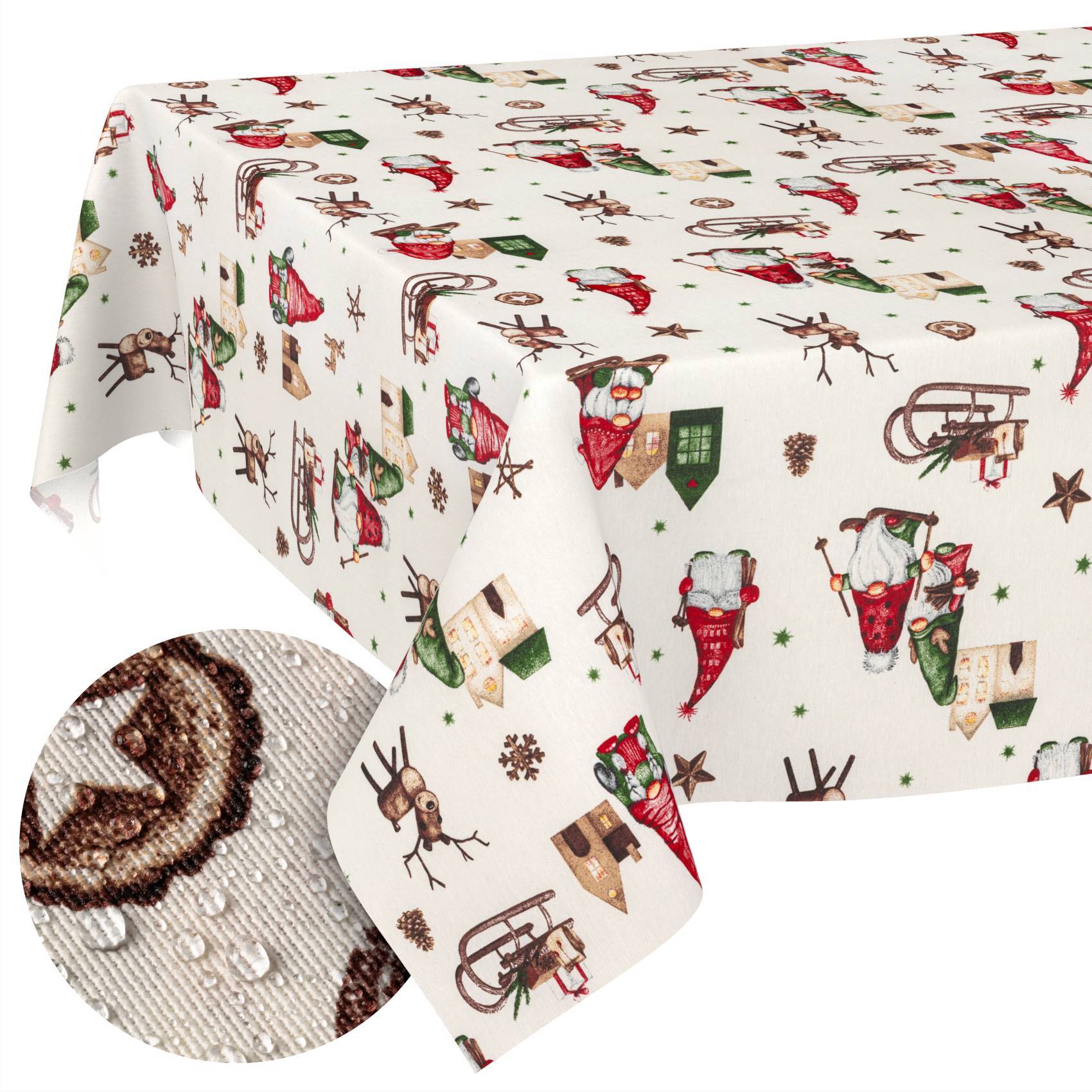 Weiße Feiertagstischdecke mit dem Weihnachtsmann, Rentieren, Schlitten und kleinen Häusern; eingefügte Nahaufnahme zeigt strukturiertes Gewebe und wasserabstoßende Tropfen.