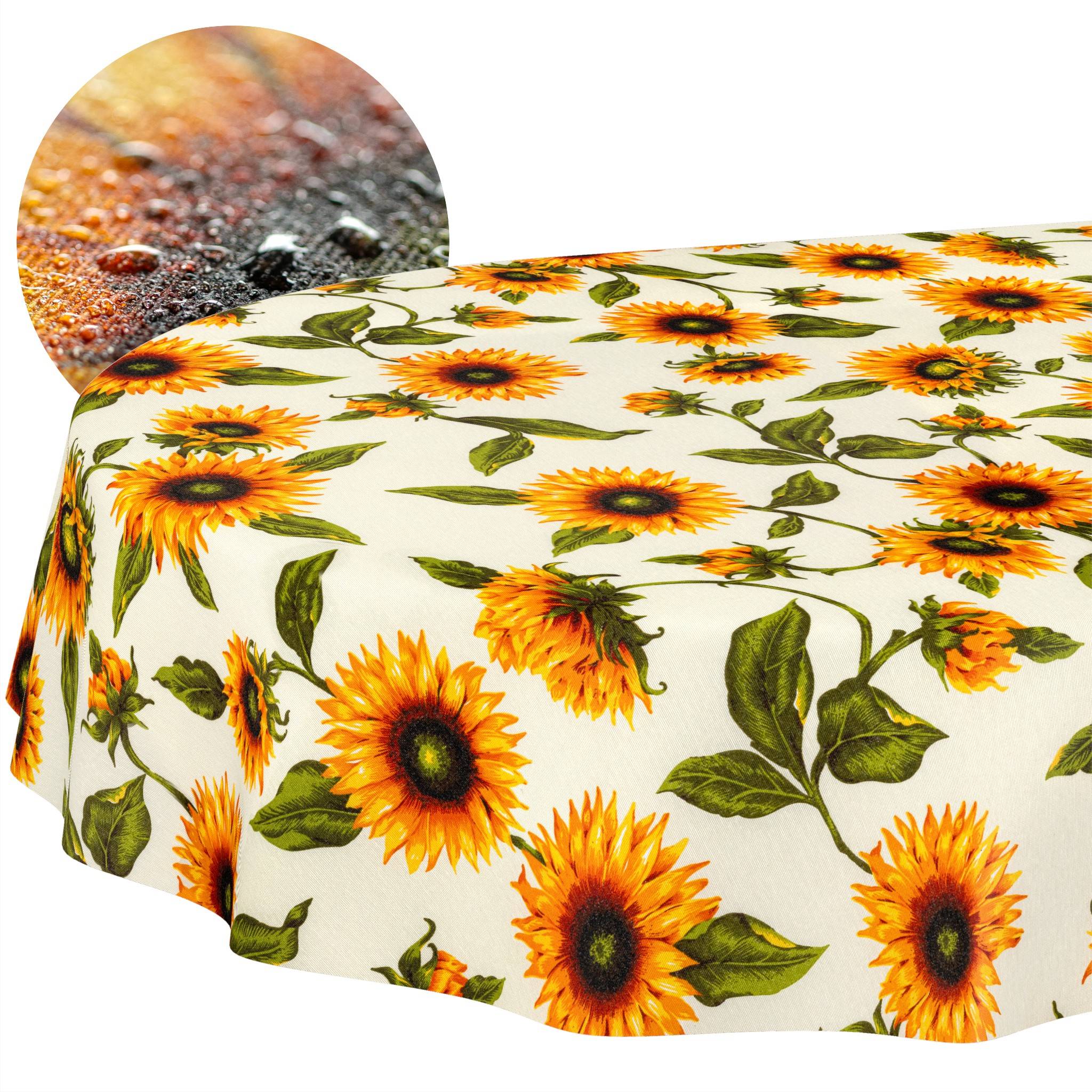 Runder Tisch mit einer Tischdecke im Sonnenblumenmuster, dargestellt mit einer kreisförmigen Detailaufnahme der Stoffstruktur.