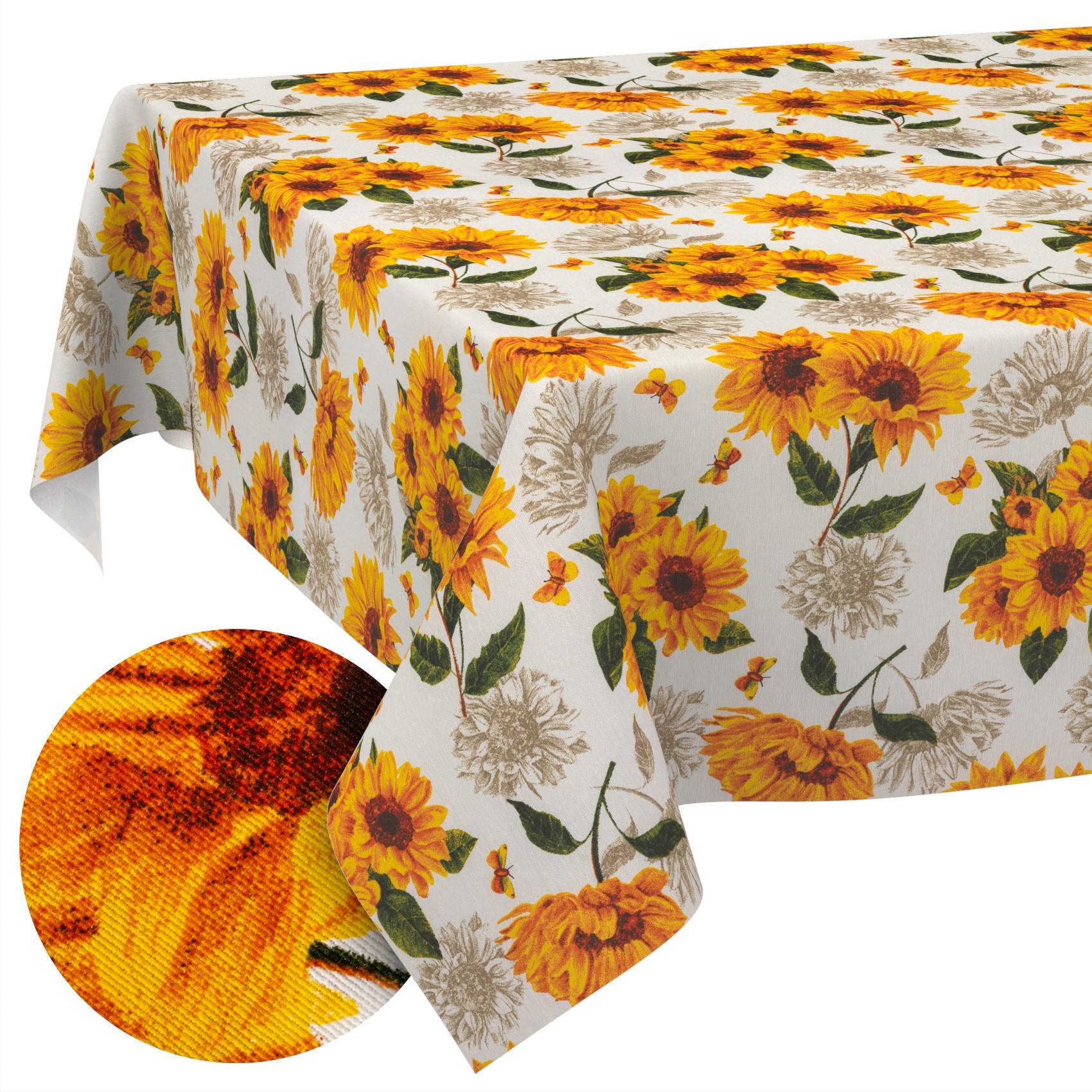 Tischdecke mit Sonnenblumenmotiv in Orange, Gelb und Weiß, über einem Tisch drapiert dargestellt, mit einer Nahaufnahme der Stofftextur in einem Bildeinsatz.