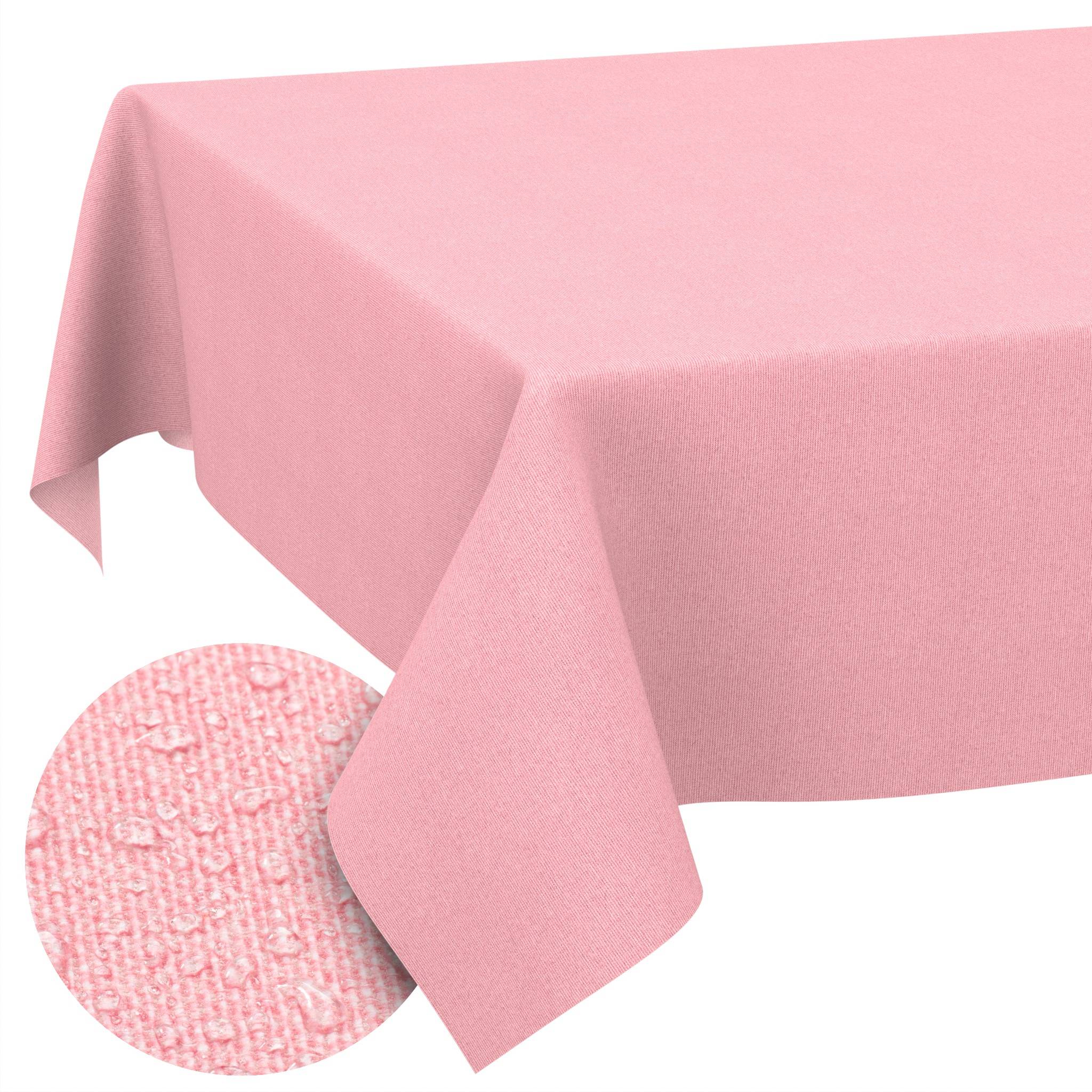 Rosa Tischdecke, die über einem Tisch drapiert ist, mit einer kreisförmigen vergrößerten Ansicht, die die strukturierte Webart des Stoffes in Nahaufnahme zeigt.