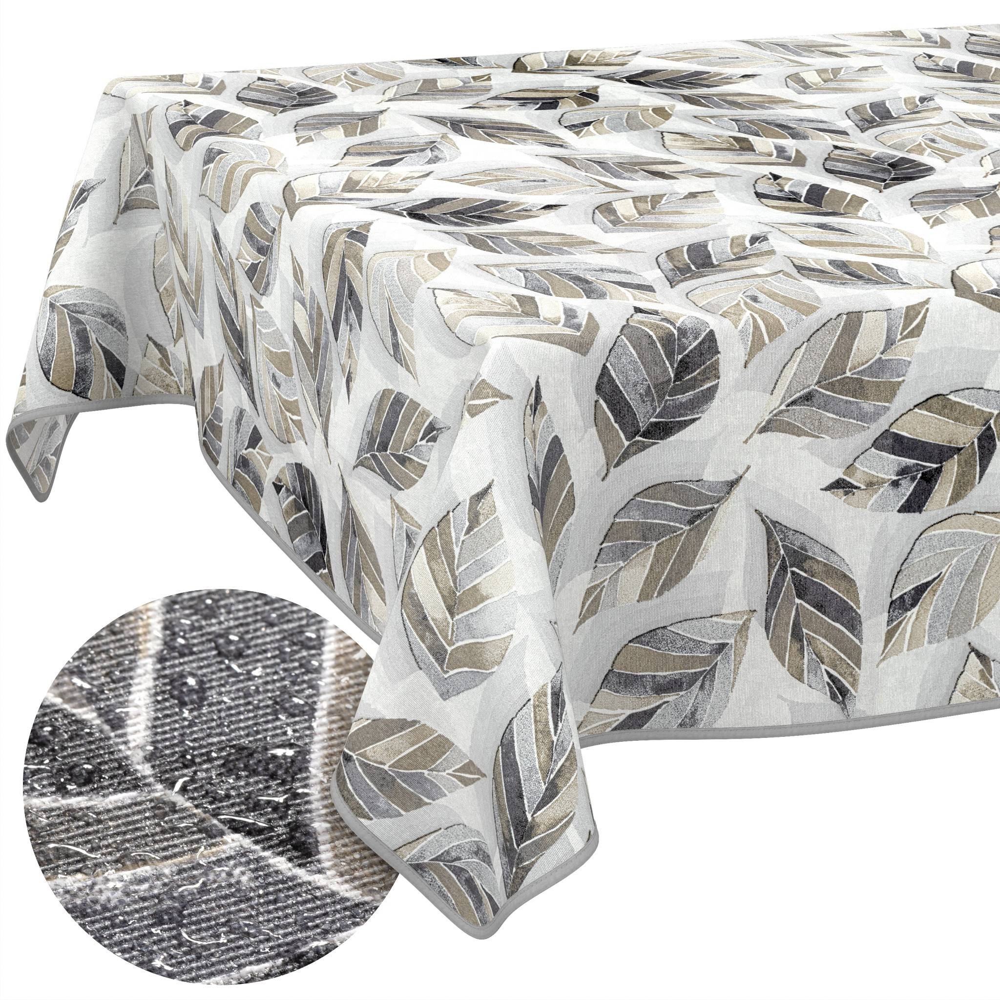 Gemustertes Tischtuch mit Blatttmotiv in Grau, Beige und Weiß, das über einem Tisch drapiert gezeigt wird, mit einer Nahaufnahme der Stofftextur in einem Ausschnitt.