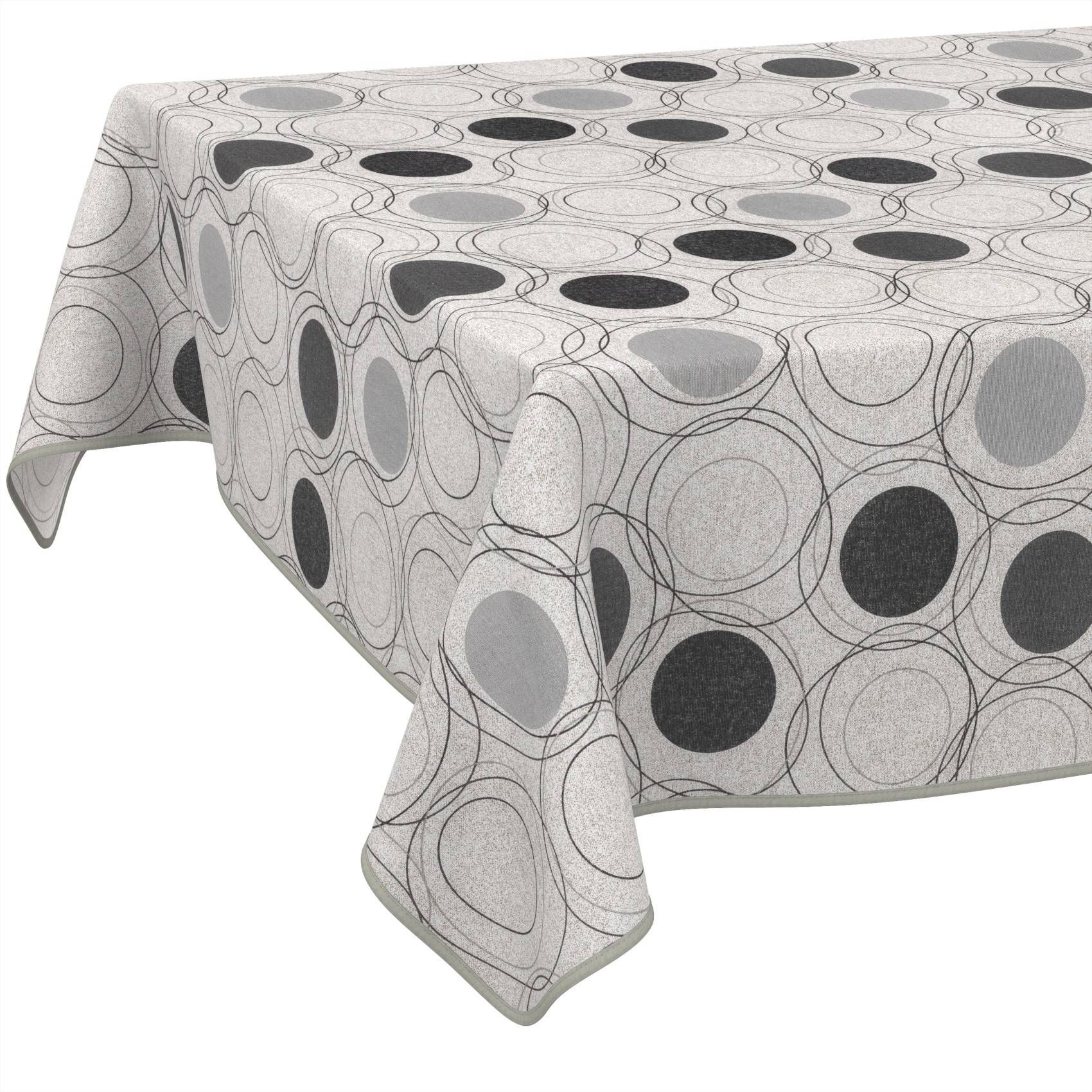 Rechteckiger Tisch mit einer hellgrauen geometrischen Kreismuster-Tischdecke.