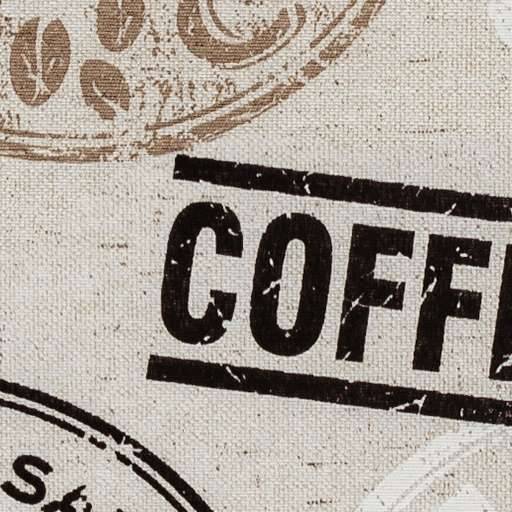 Nahaufnahme eines beschädigten Kaffeepackungsetiketts mit dem Wort „COFFEE" in fetter schwarzer Schrift und braunen stempelähnlichen kreisförmigen Grafiken auf beigem Hintergrund.