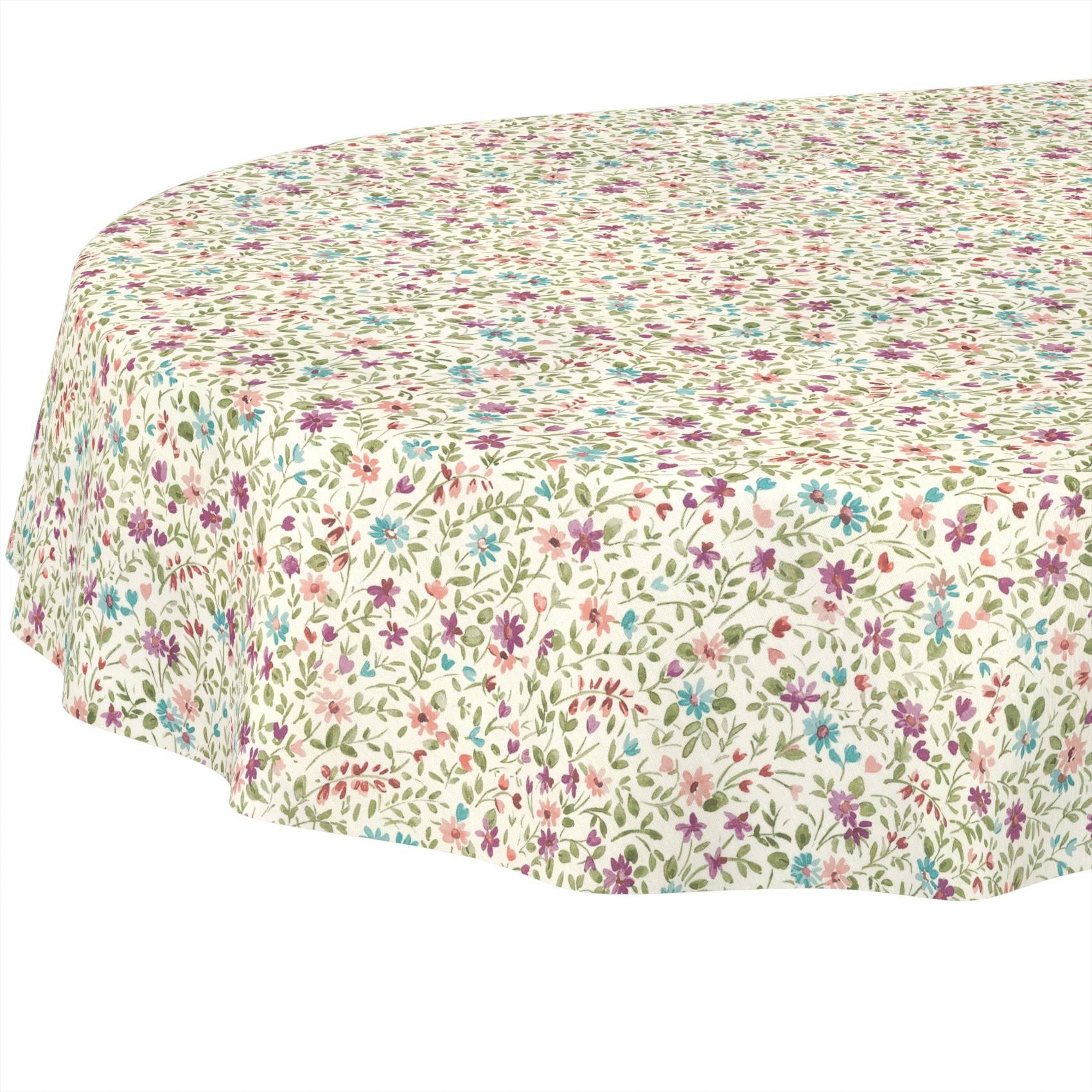 Runde Tischdecke mit einem kleinen mehrfarbigen Blumenmuster auf weißem Untergrund.