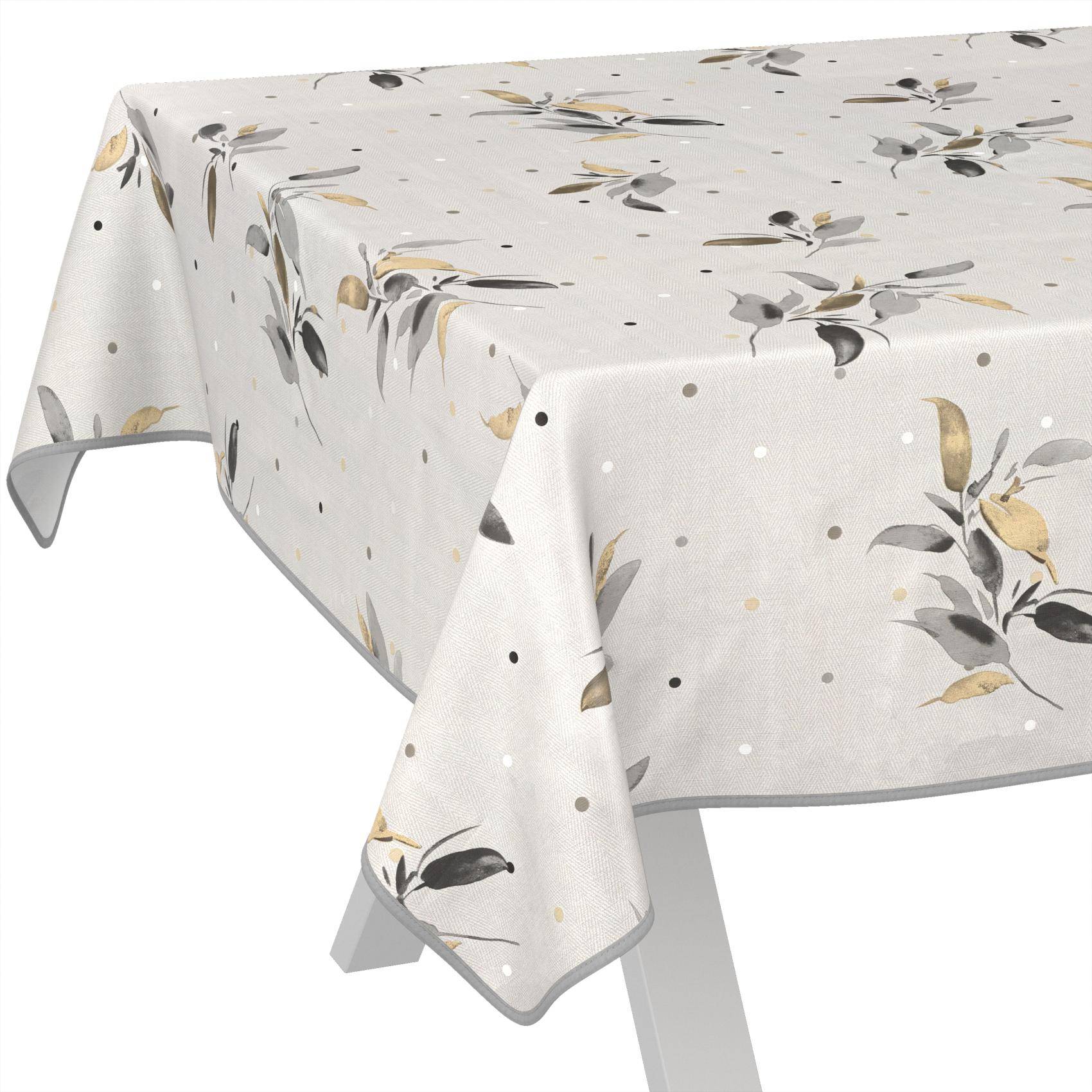 Weiße Tischdecke mit grauem, schwarzem und goldenem Blumen- und Pünktchenmuster, die über einen rechteckigen Tisch drapiert ist.