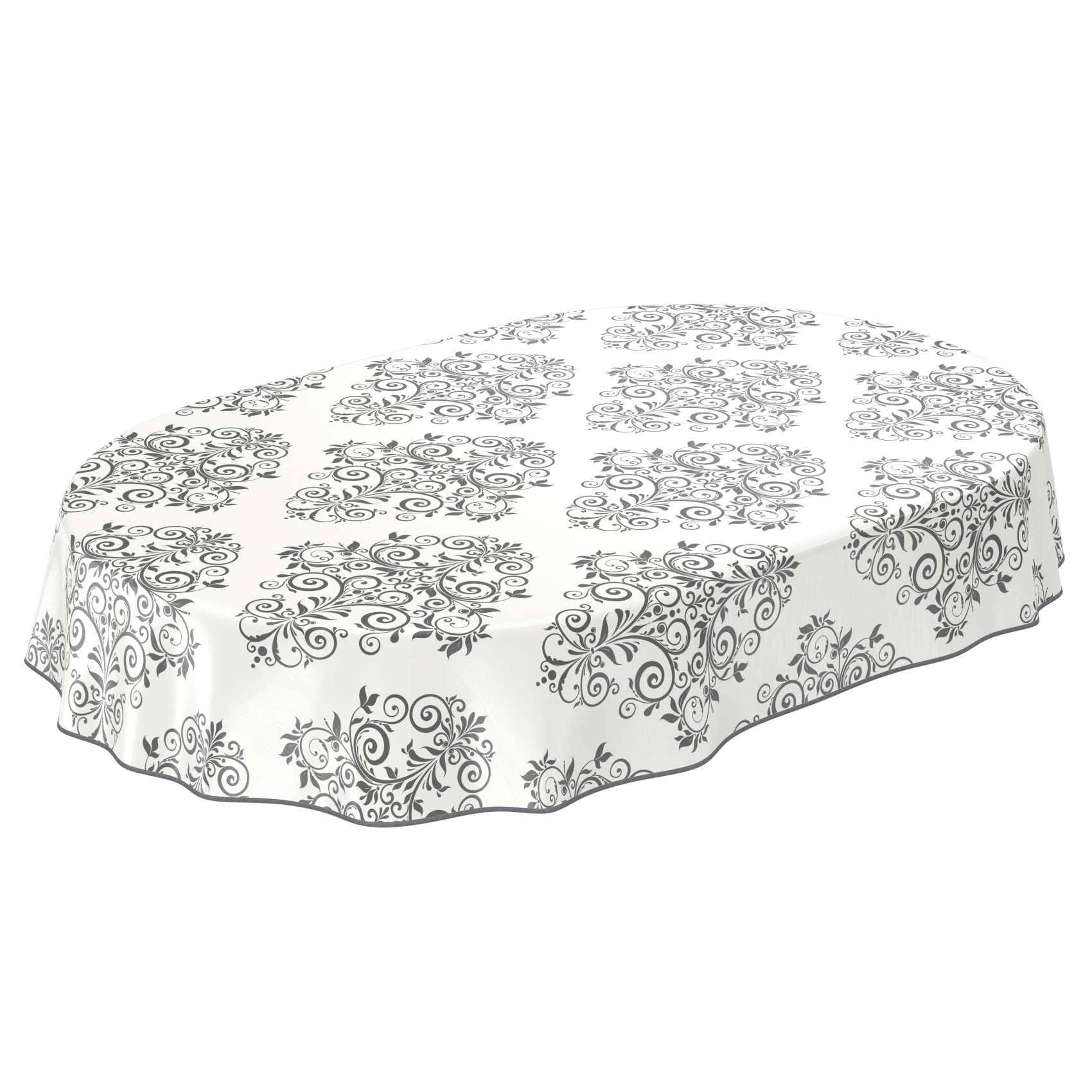 Ovaler Tisch mit einer weißen Tischdecke, die mit grauen Blumenverzierungen verziert ist.