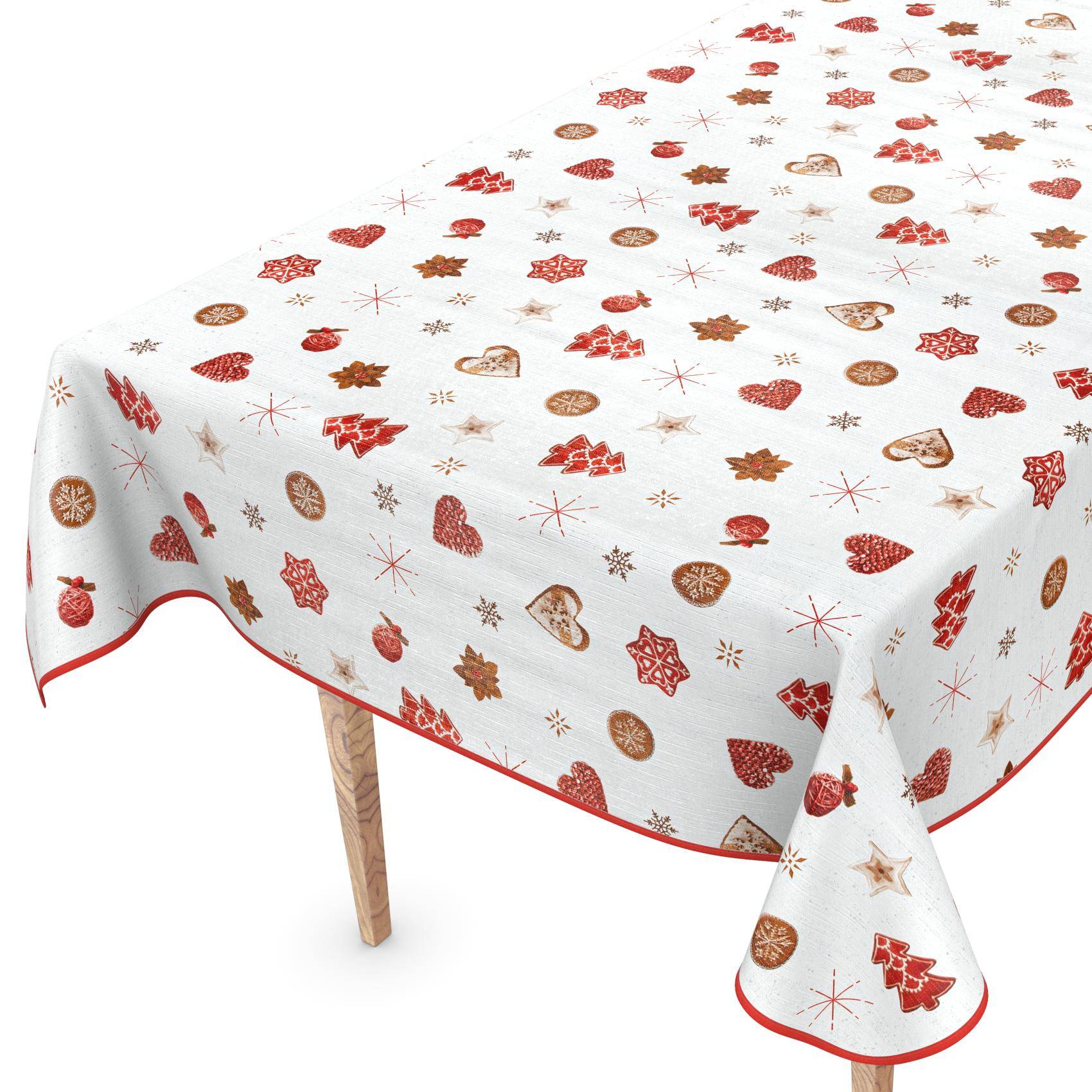 Weiße Tischdecke mit roten und goldenen Feiertagsmotiven, einschließlich Herzen, Sternen, Bäumen und Schneeflocken, über einem Tisch auf weißem Hintergrund drapiert.